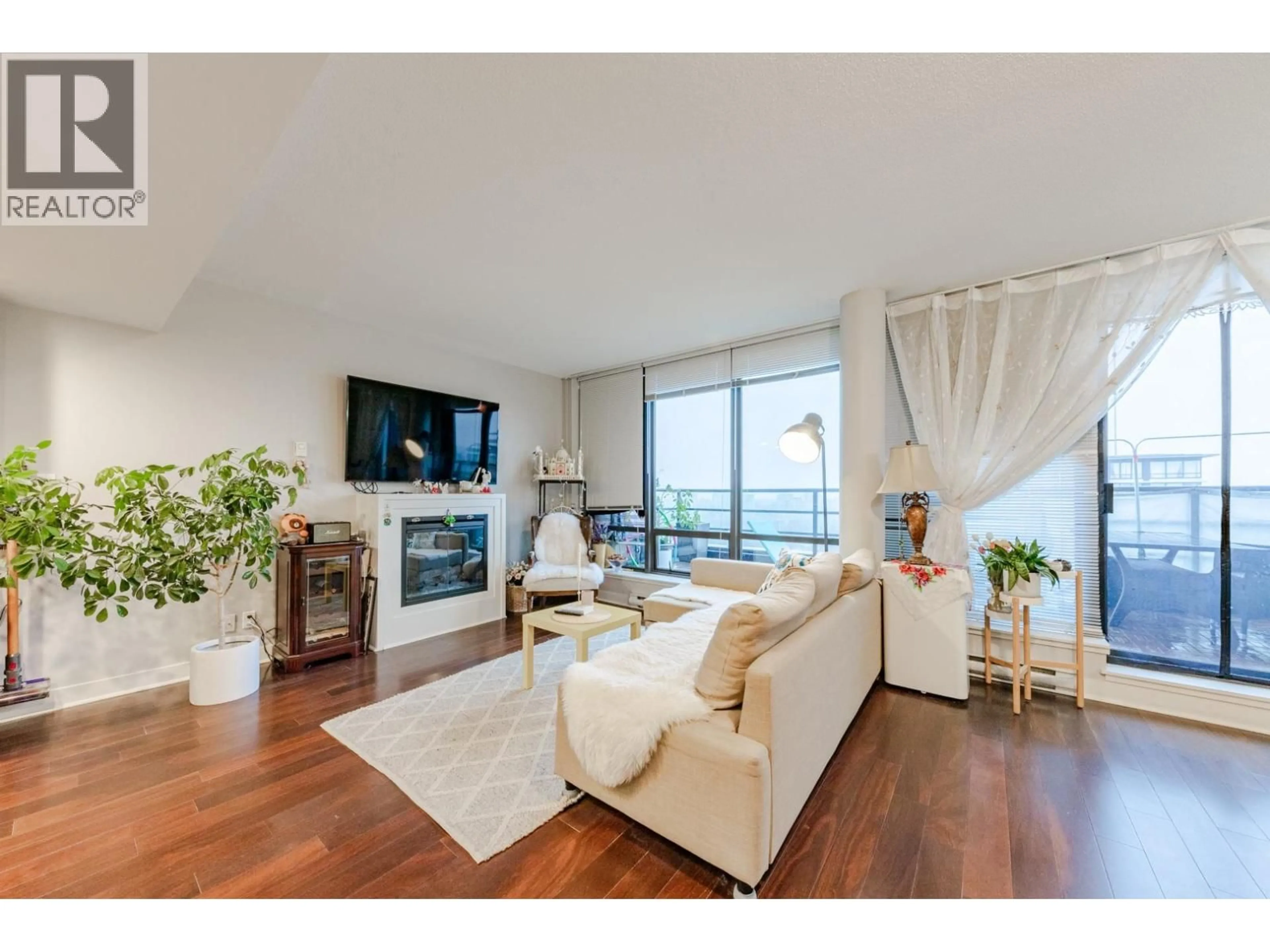 Living room with furniture, wood/laminate floor for 1805 - 6333 KATSURA STREET, Richmond British Columbia V6Y4L9