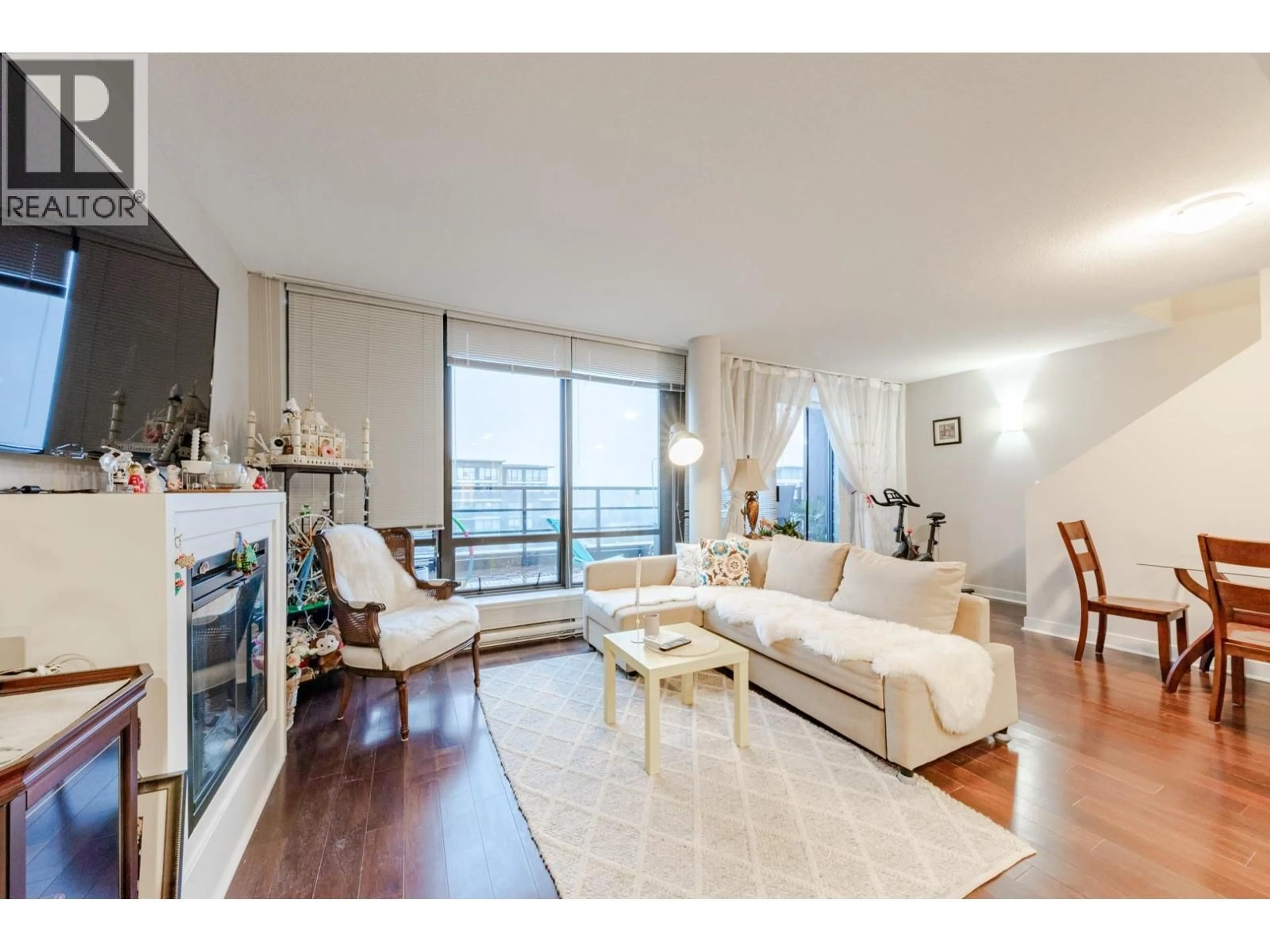 Living room with furniture, wood/laminate floor for 1805 - 6333 KATSURA STREET, Richmond British Columbia V6Y4L9