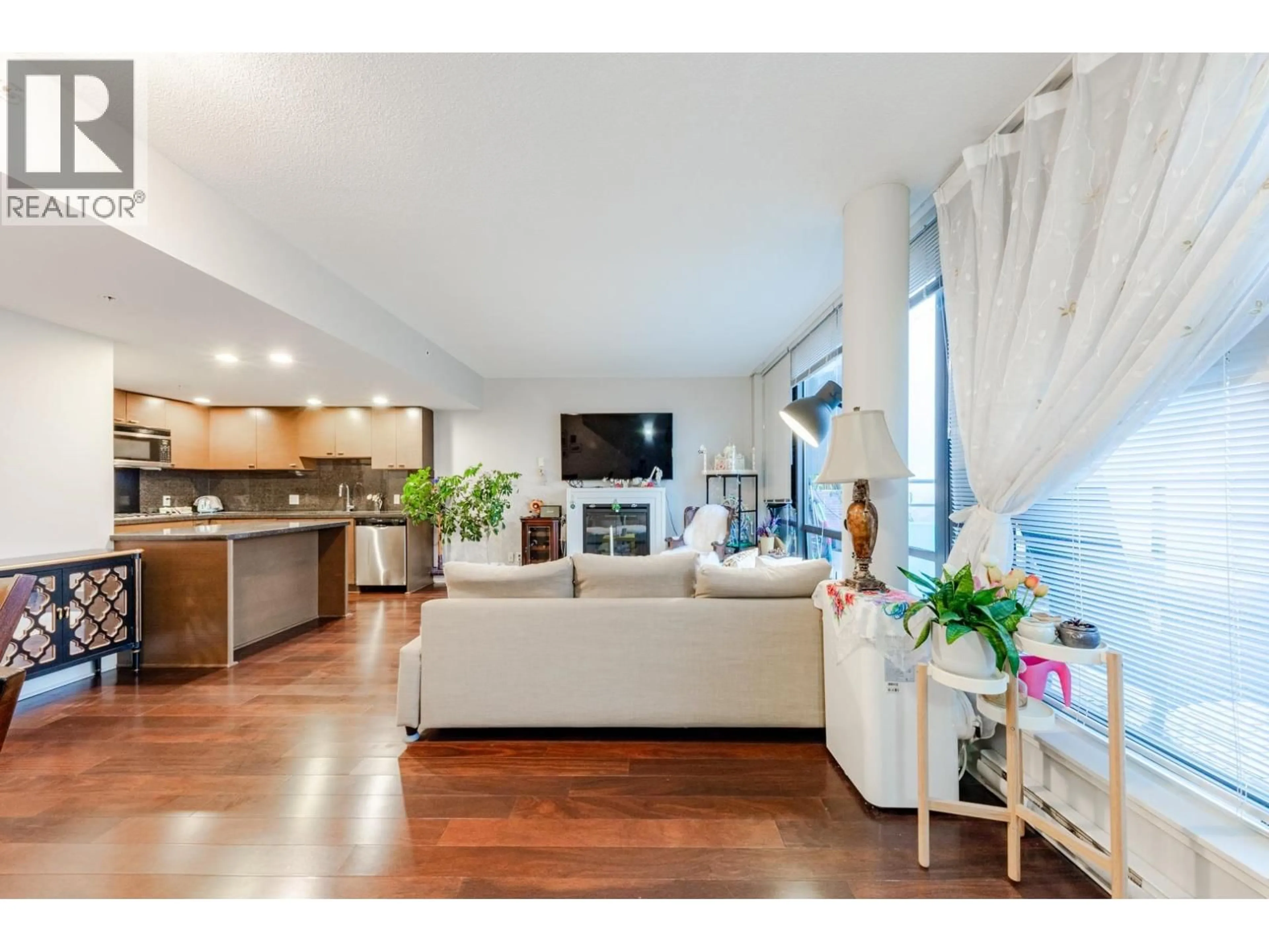 Living room with furniture, wood/laminate floor for 1805 - 6333 KATSURA STREET, Richmond British Columbia V6Y4L9