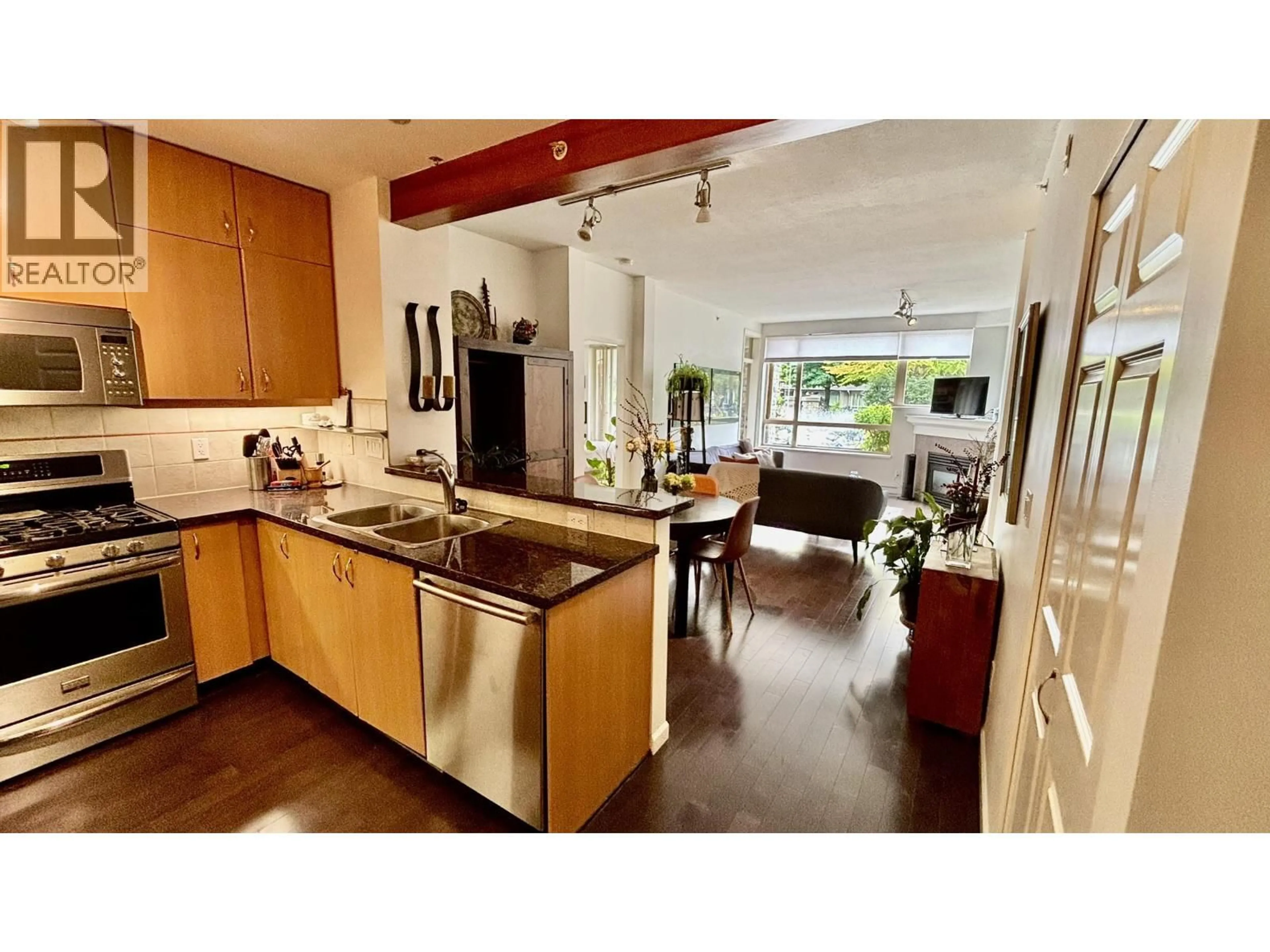 Open concept kitchen, ceramic/tile floor for 109 - 580 RAVEN WOODS DRIVE, North Vancouver British Columbia V7G2T2