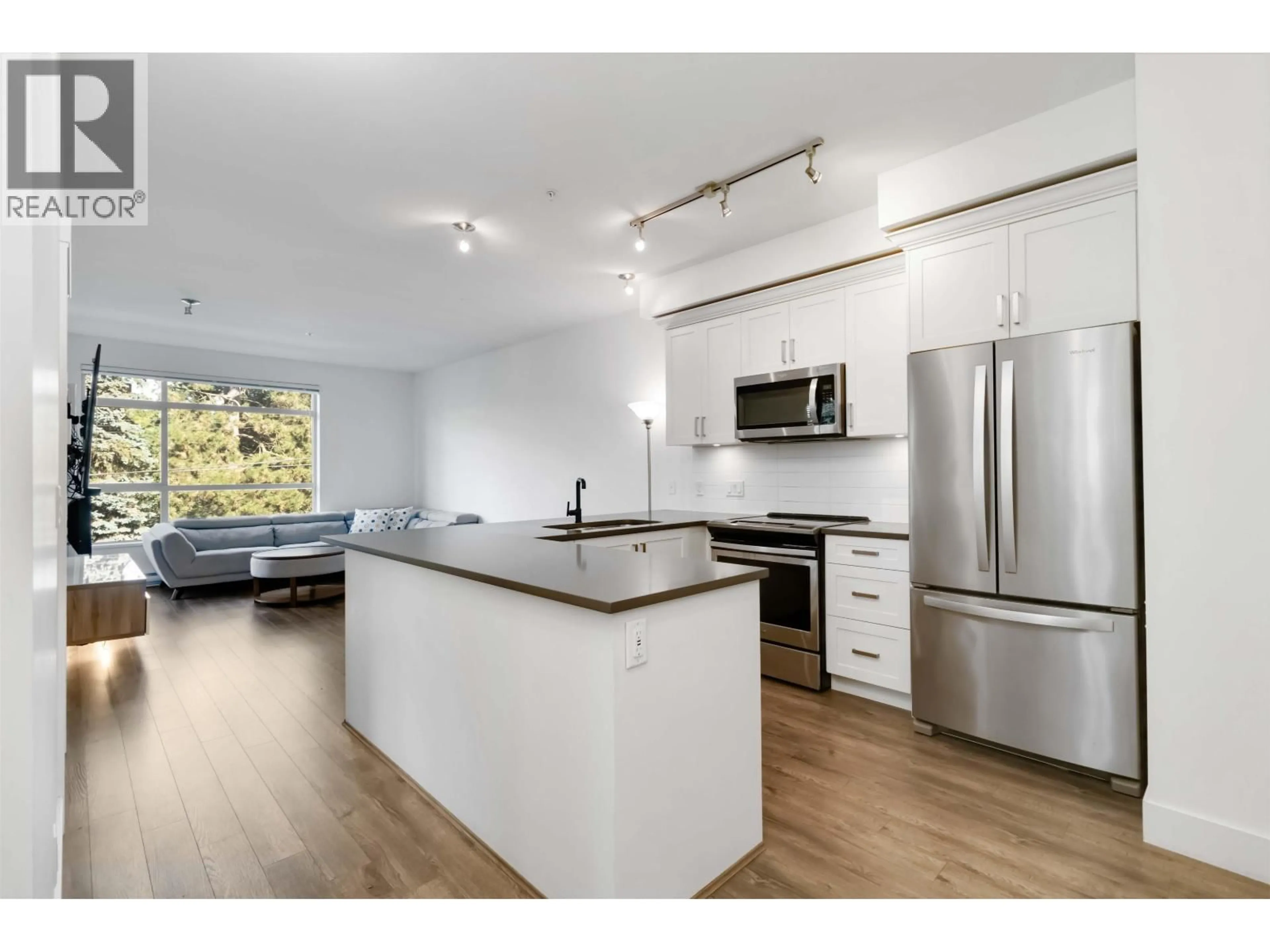 Open concept kitchen, wood/laminate floor for 208 - 2436 KELLY AVENUE, Port Coquitlam British Columbia V3C0G9