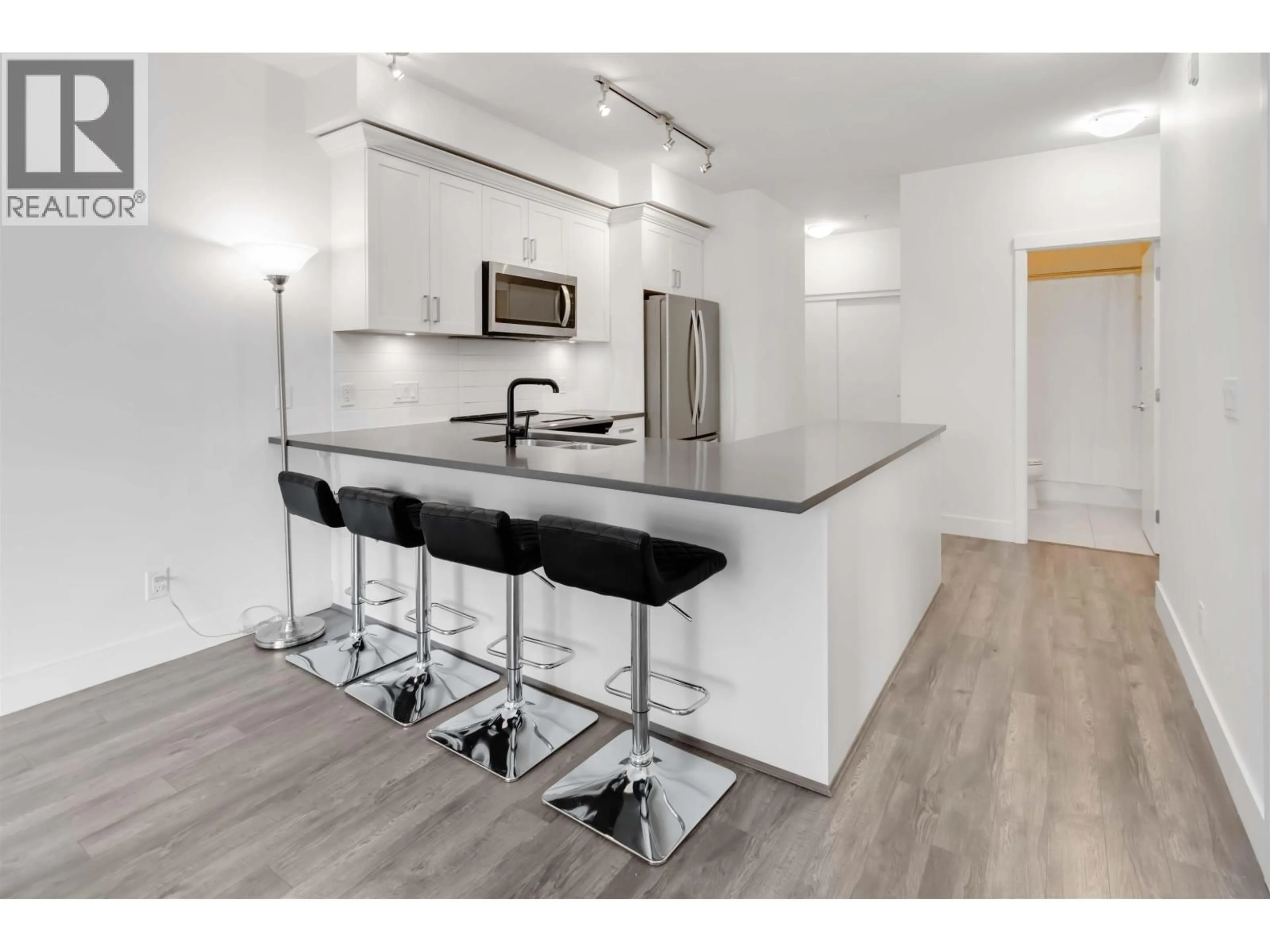 Open concept kitchen, wood/laminate floor for 208 - 2436 KELLY AVENUE, Port Coquitlam British Columbia V3C0G9