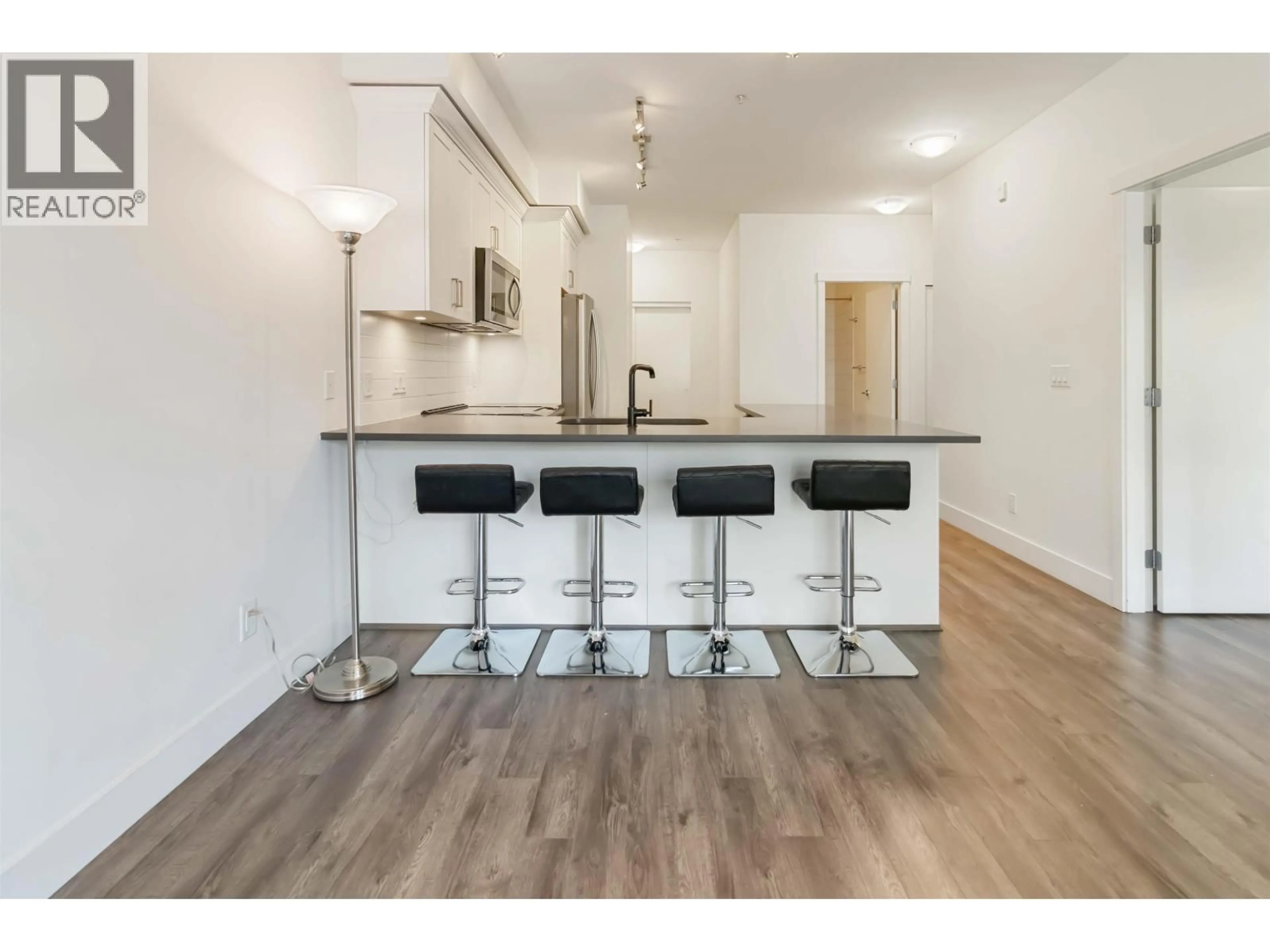 Open concept kitchen, wood/laminate floor for 208 - 2436 KELLY AVENUE, Port Coquitlam British Columbia V3C0G9