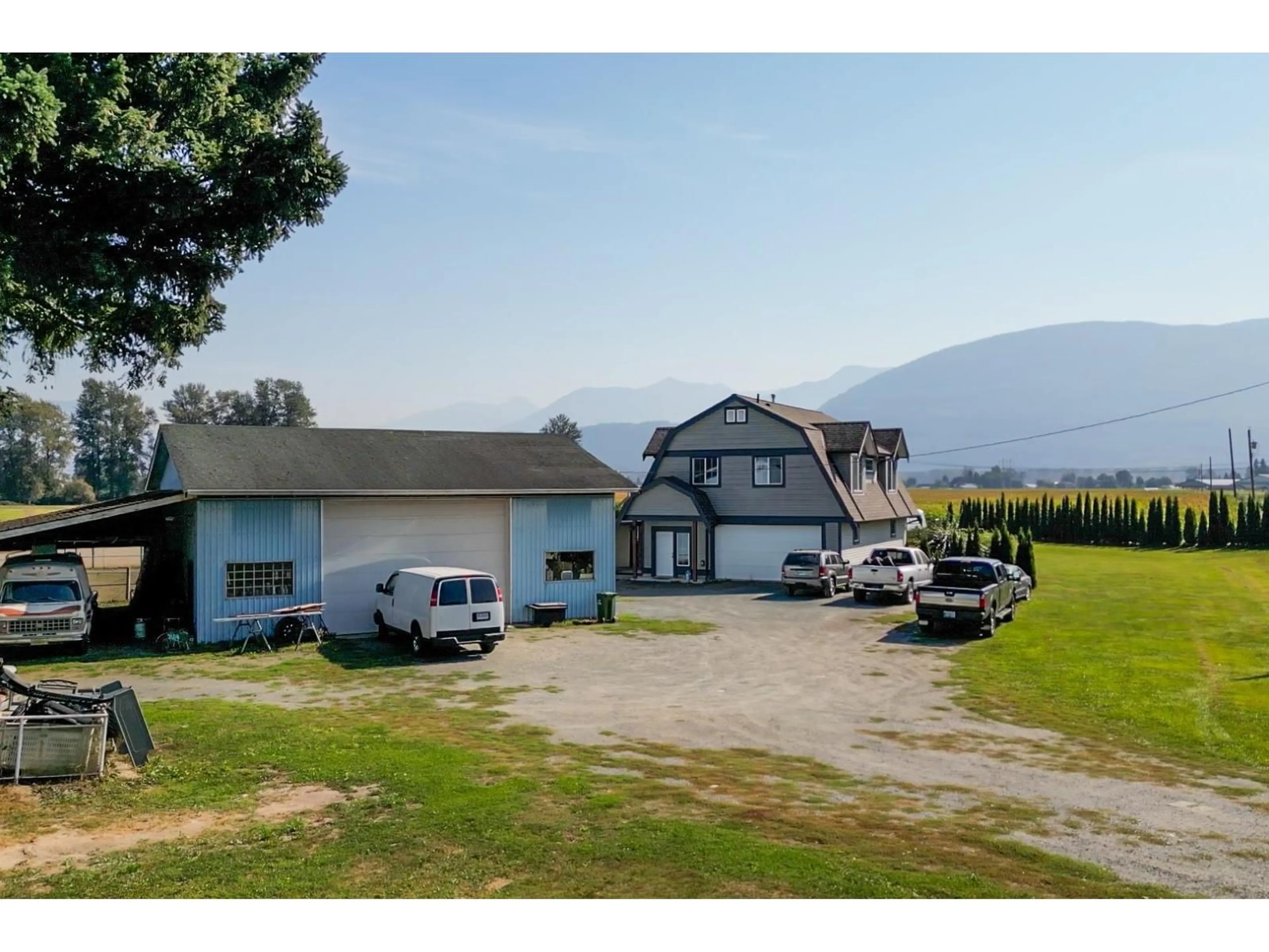 A pic from outside/outdoor area/front of a property/back of a property/a pic from drone, mountain view for 6050 CHADSEY ROAD, Chilliwack British Columbia V2R4P2