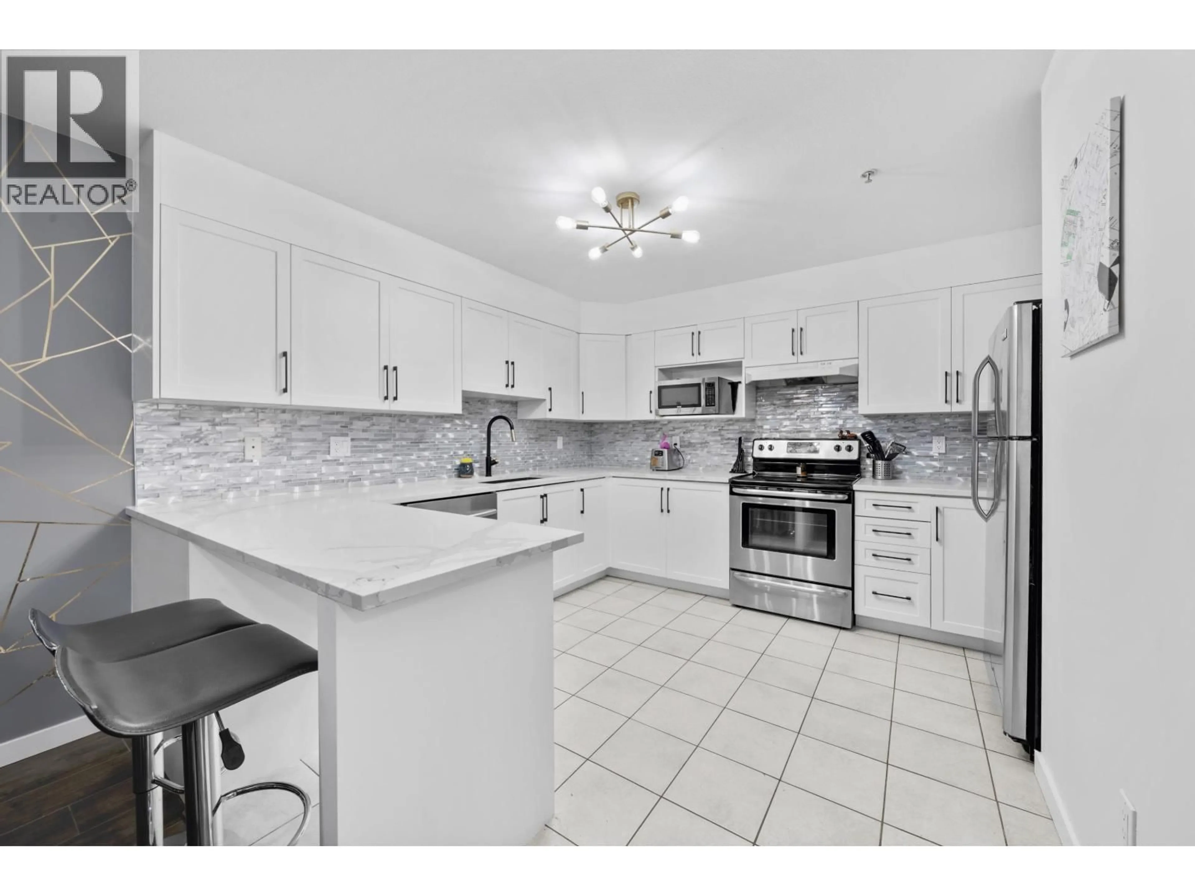 Open concept kitchen, ceramic/tile floor for 311 - 121 SHORELINE CIRCLE, Port Moody British Columbia V3H5G2
