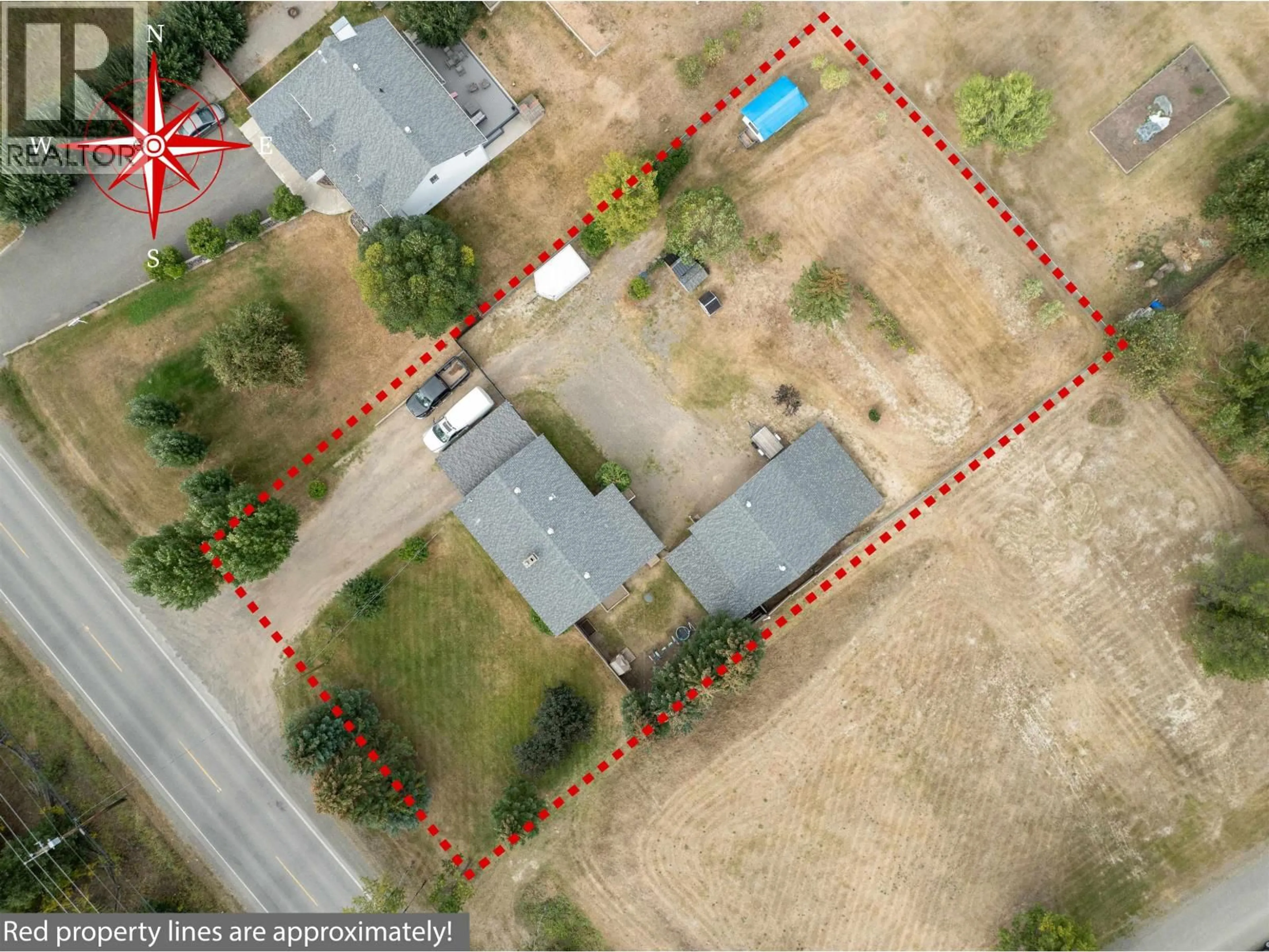 A pic from outside/outdoor area/front of a property/back of a property/a pic from drone, street for 5665 HORSE LAKE ROAD, 100 Mile House British Columbia V0K2E1