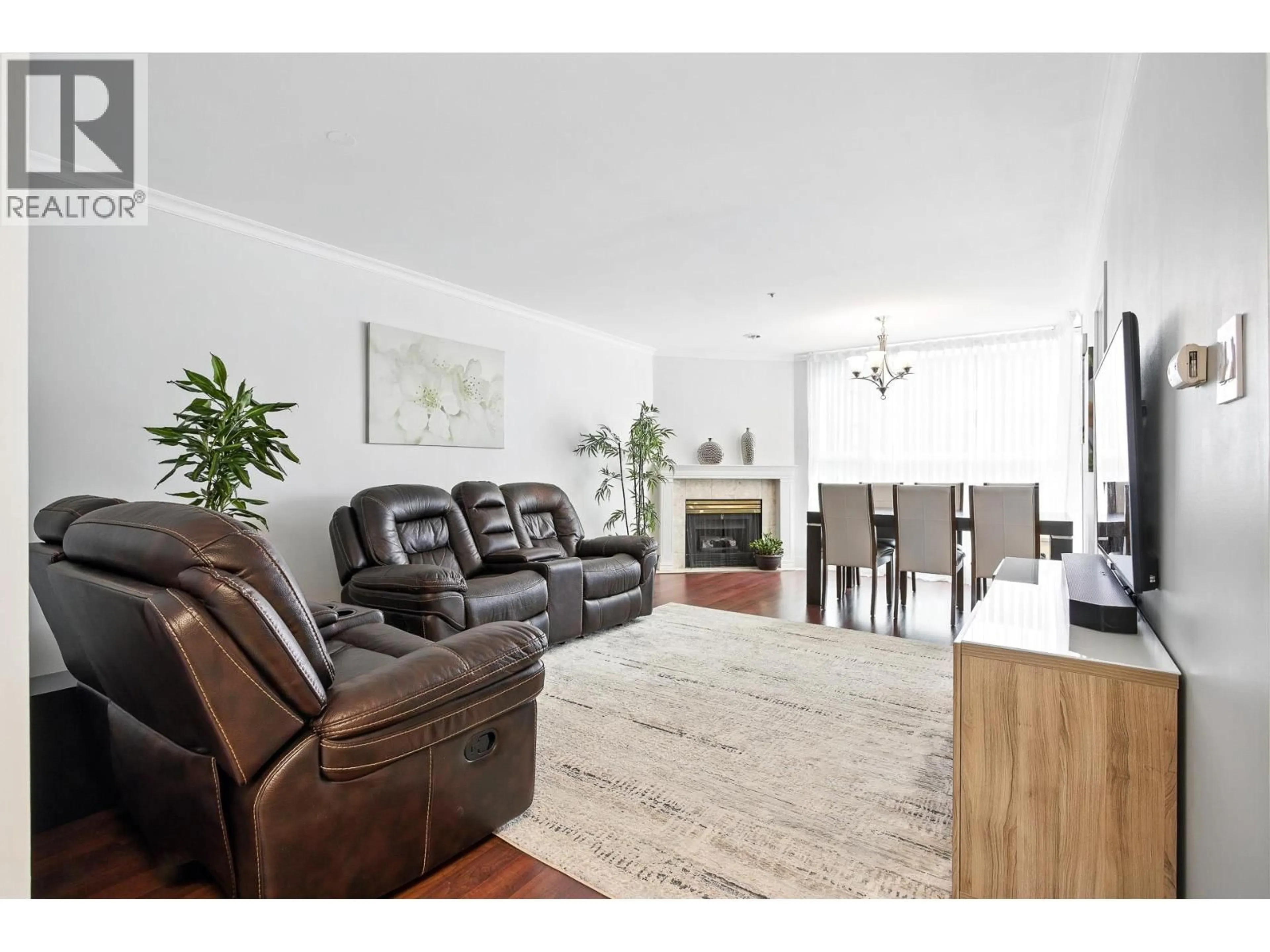 Living room with furniture, wood/laminate floor for 303 - 7700 GILBERT ROAD, Richmond British Columbia V7C3W2