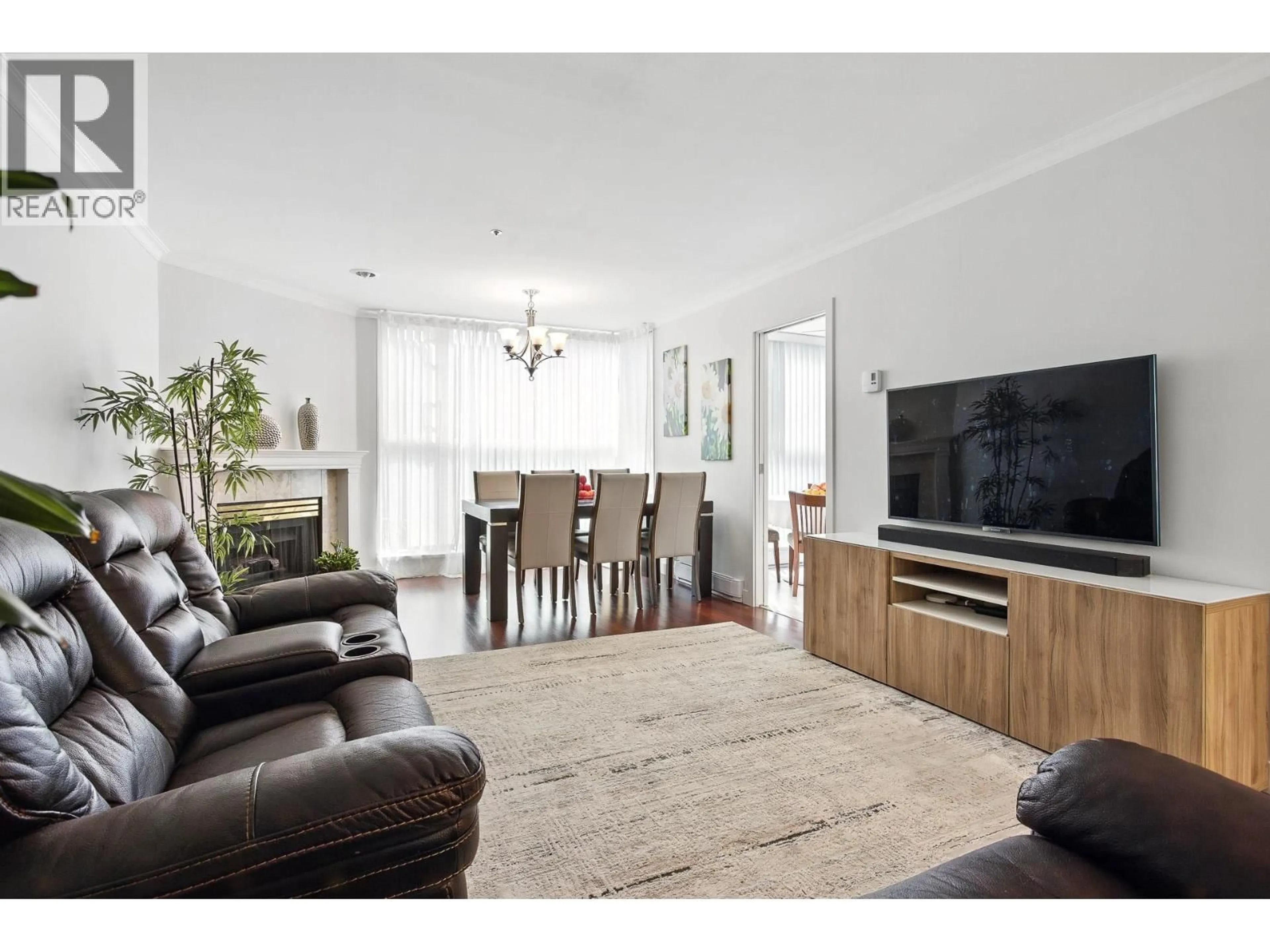 Living room with furniture, wood/laminate floor for 303 - 7700 GILBERT ROAD, Richmond British Columbia V7C3W2