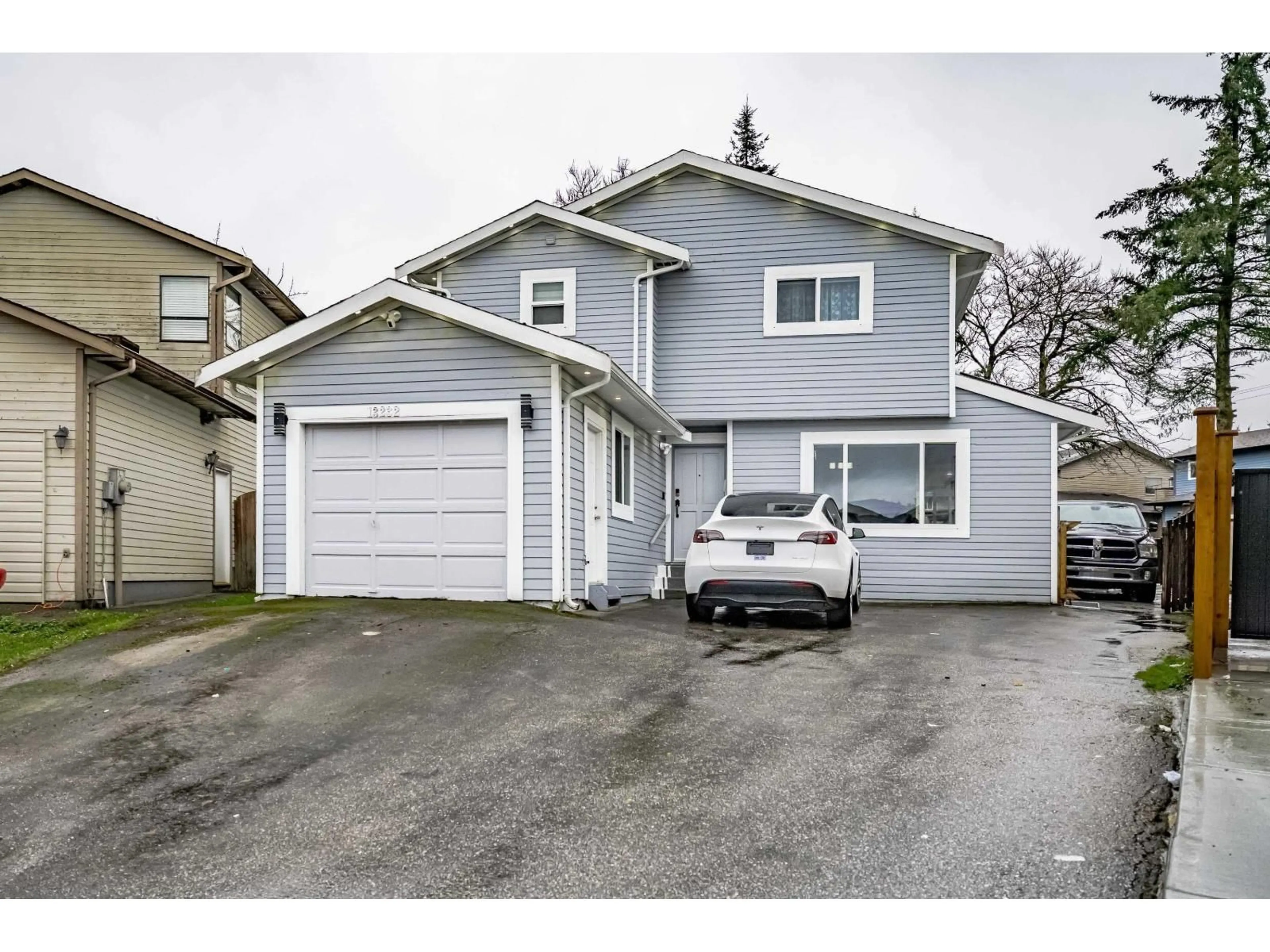 Home with vinyl exterior material, street for 13232 82, Surrey British Columbia V3W8Z4