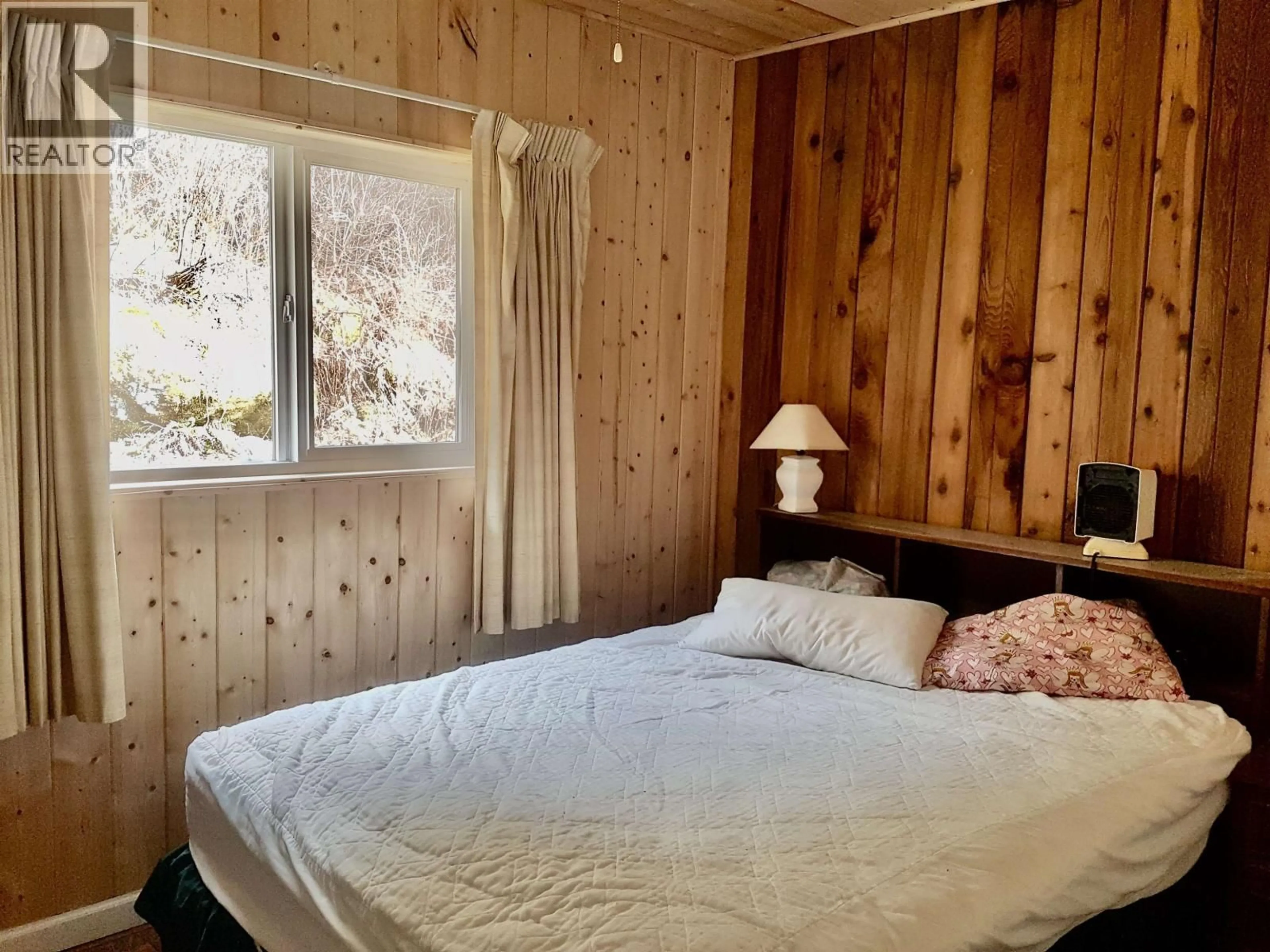Bedroom with bed, wood/laminate floor for 75 HIGHLAND DRIVE, Bella Coola British Columbia V0T1P0