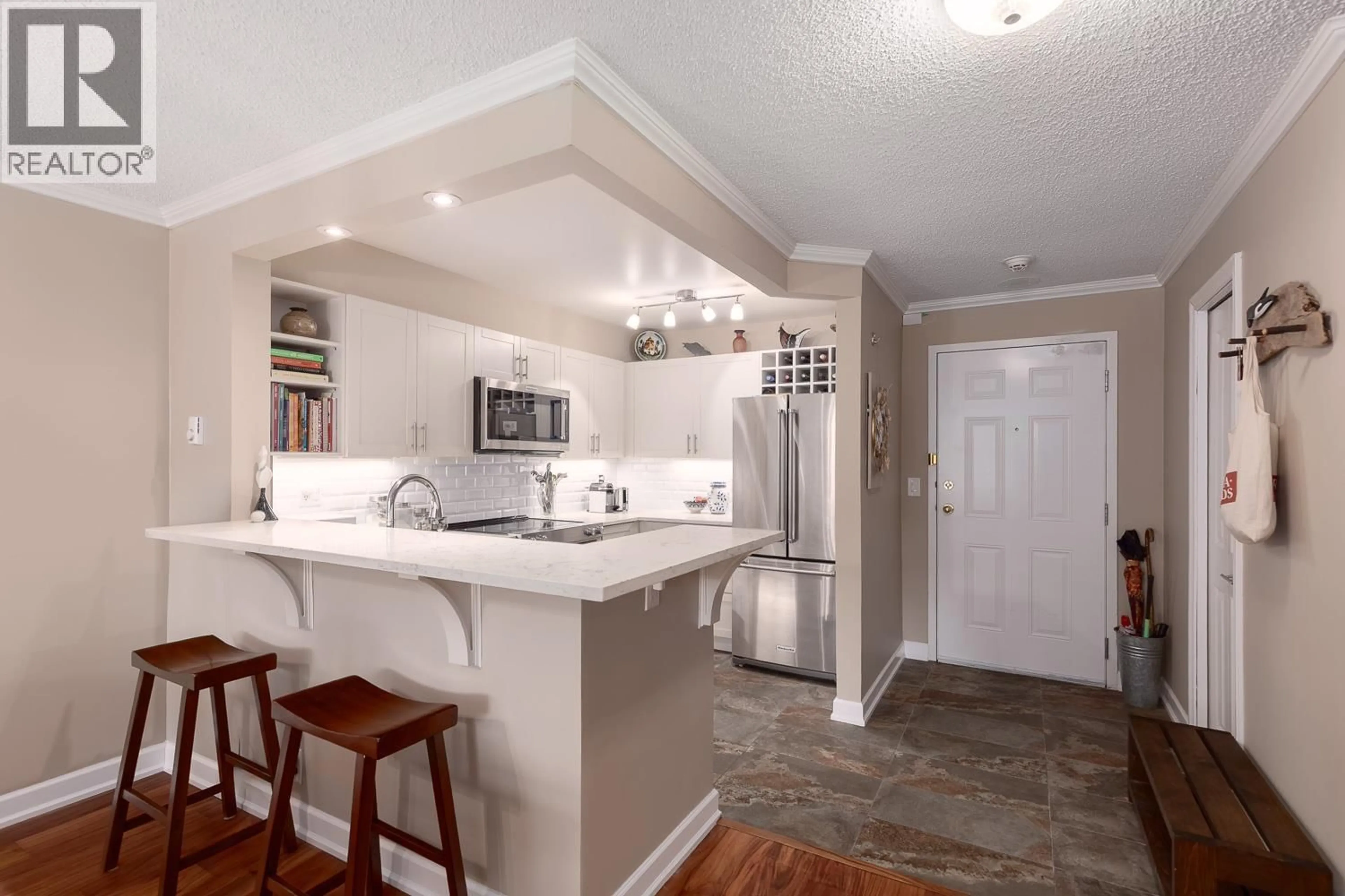 Open concept kitchen, ceramic/tile floor for 204 - 456 MOBERLY ROAD, Vancouver British Columbia V5Z4L7
