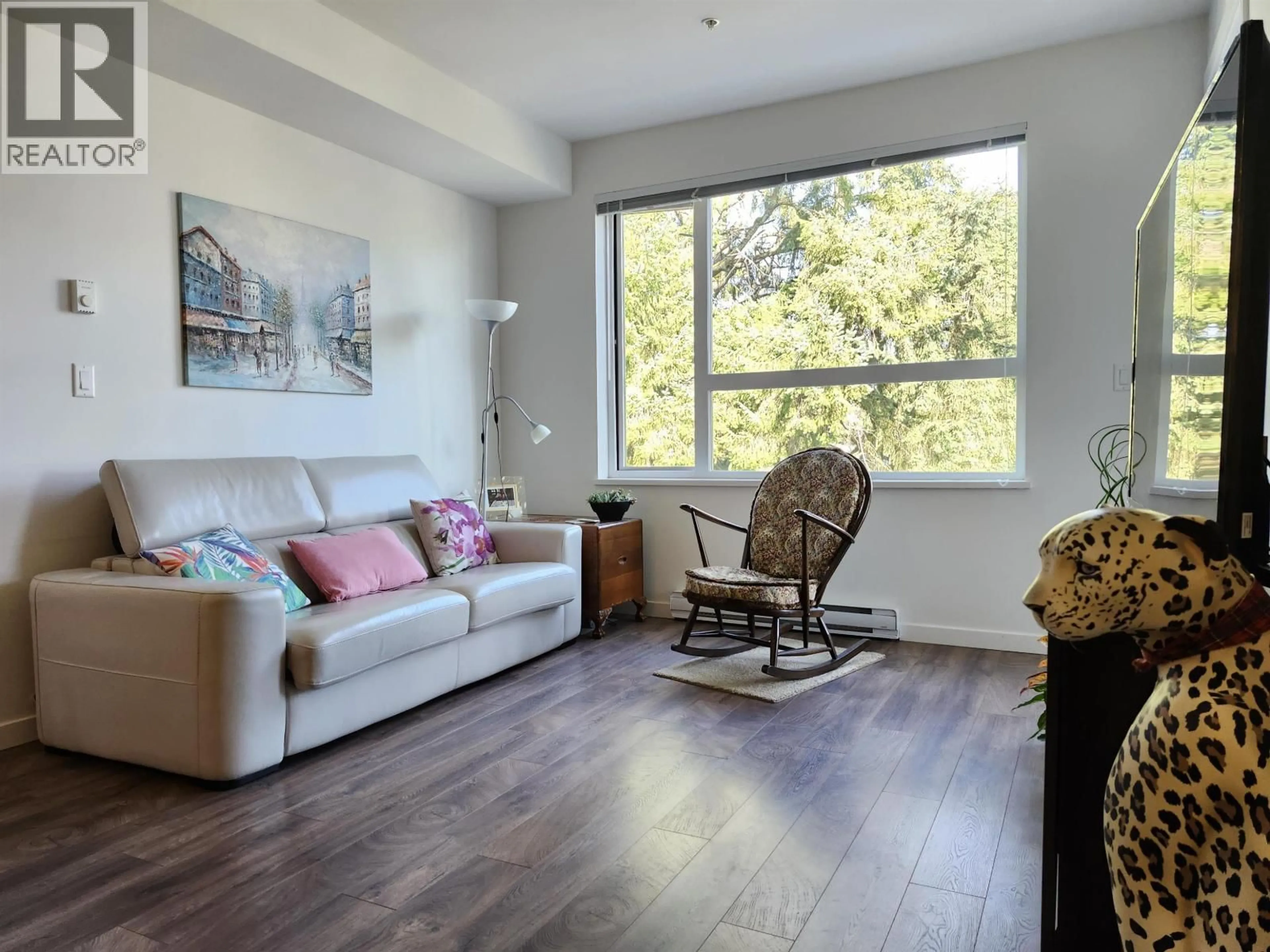 Living room with furniture, wood/laminate floor for 503 - 717 BRESLAY STREET, Coquitlam British Columbia V3J0J3