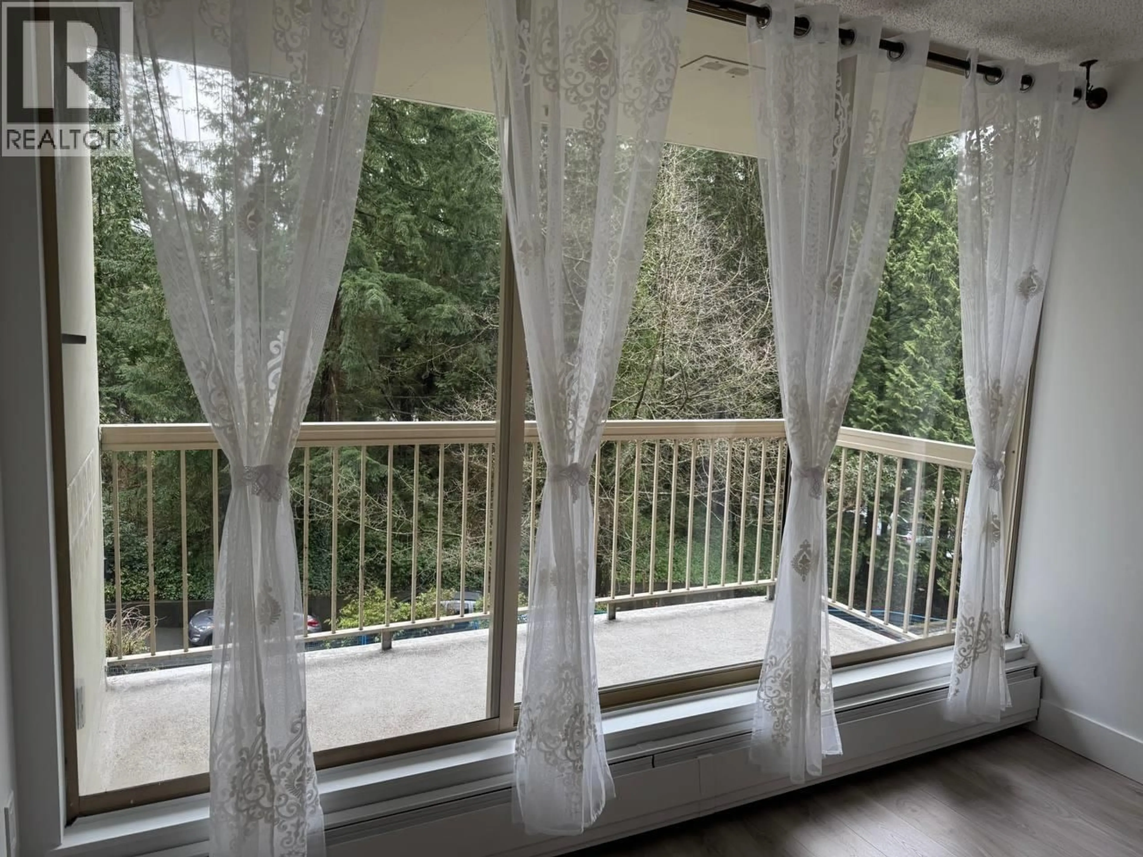 Balcony in the apartment, forest/trees view for 407 - 2008 FULLERTON AVENUE, North Vancouver British Columbia V7P3G7