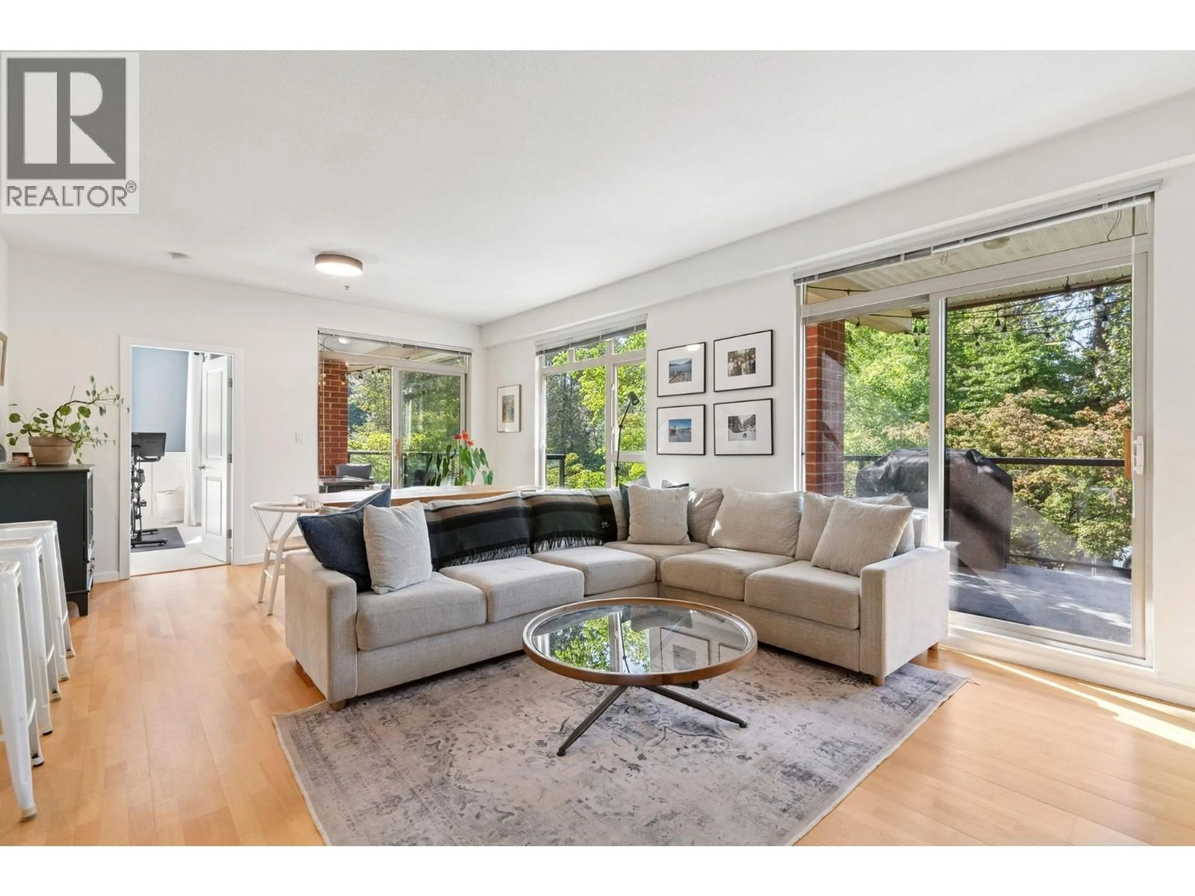 Living room with furniture, unknown for 219 - 100 CAPILANO ROAD, Port Moody British Columbia V3H5M9