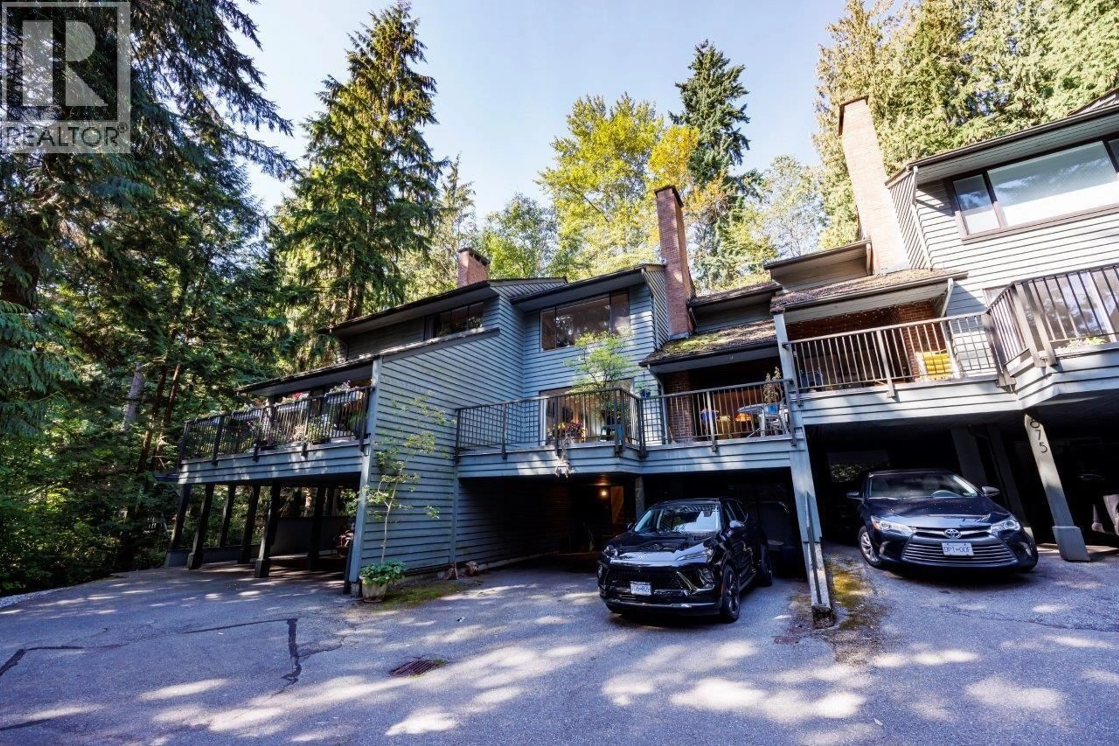 A pic from outside/outdoor area/front of a property/back of a property/a pic from drone, street for 873 HENDECOURT ROAD, North Vancouver British Columbia V7K2X5