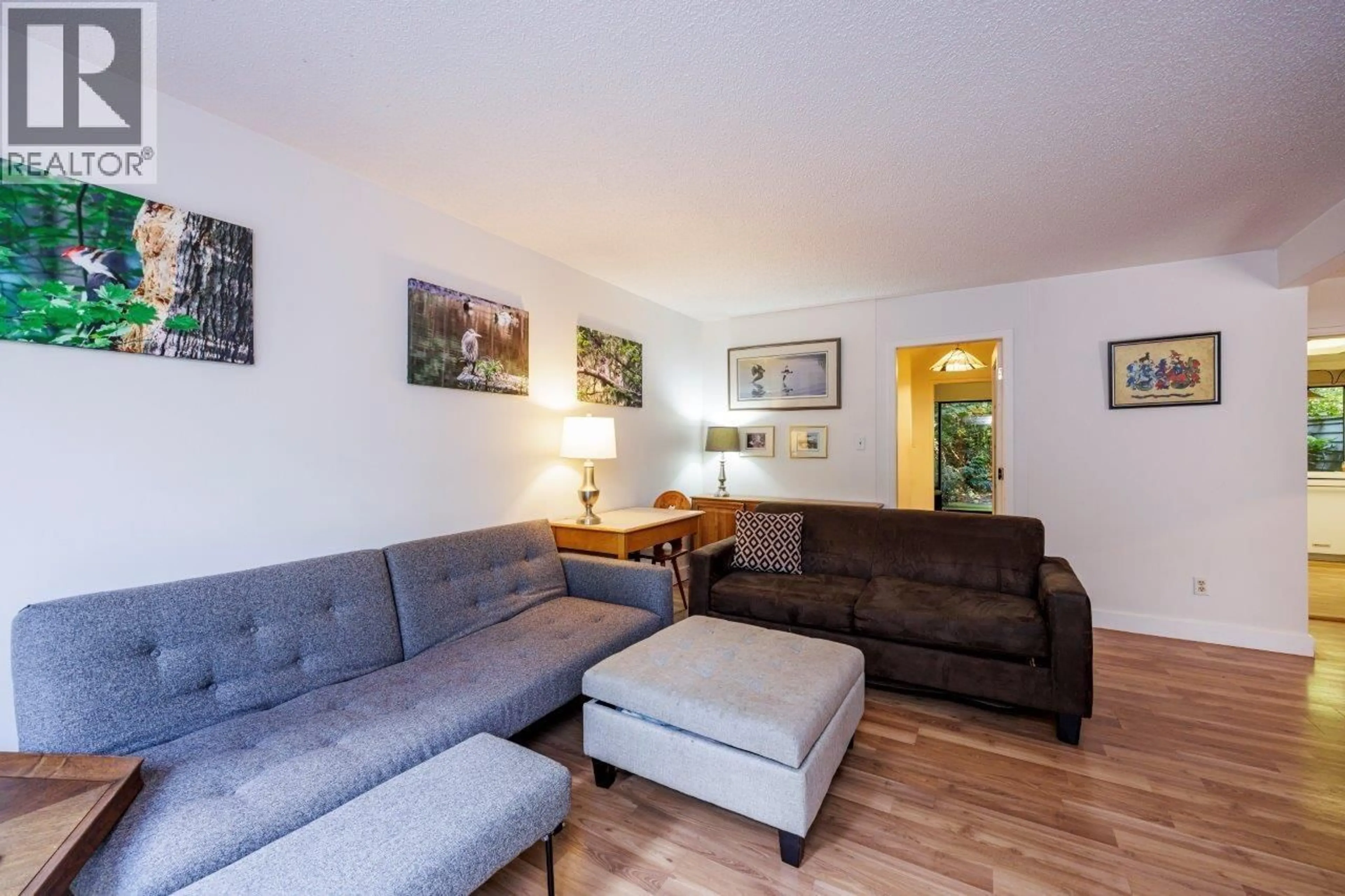 Living room with furniture, wood/laminate floor for 873 HENDECOURT ROAD, North Vancouver British Columbia V7K2X5