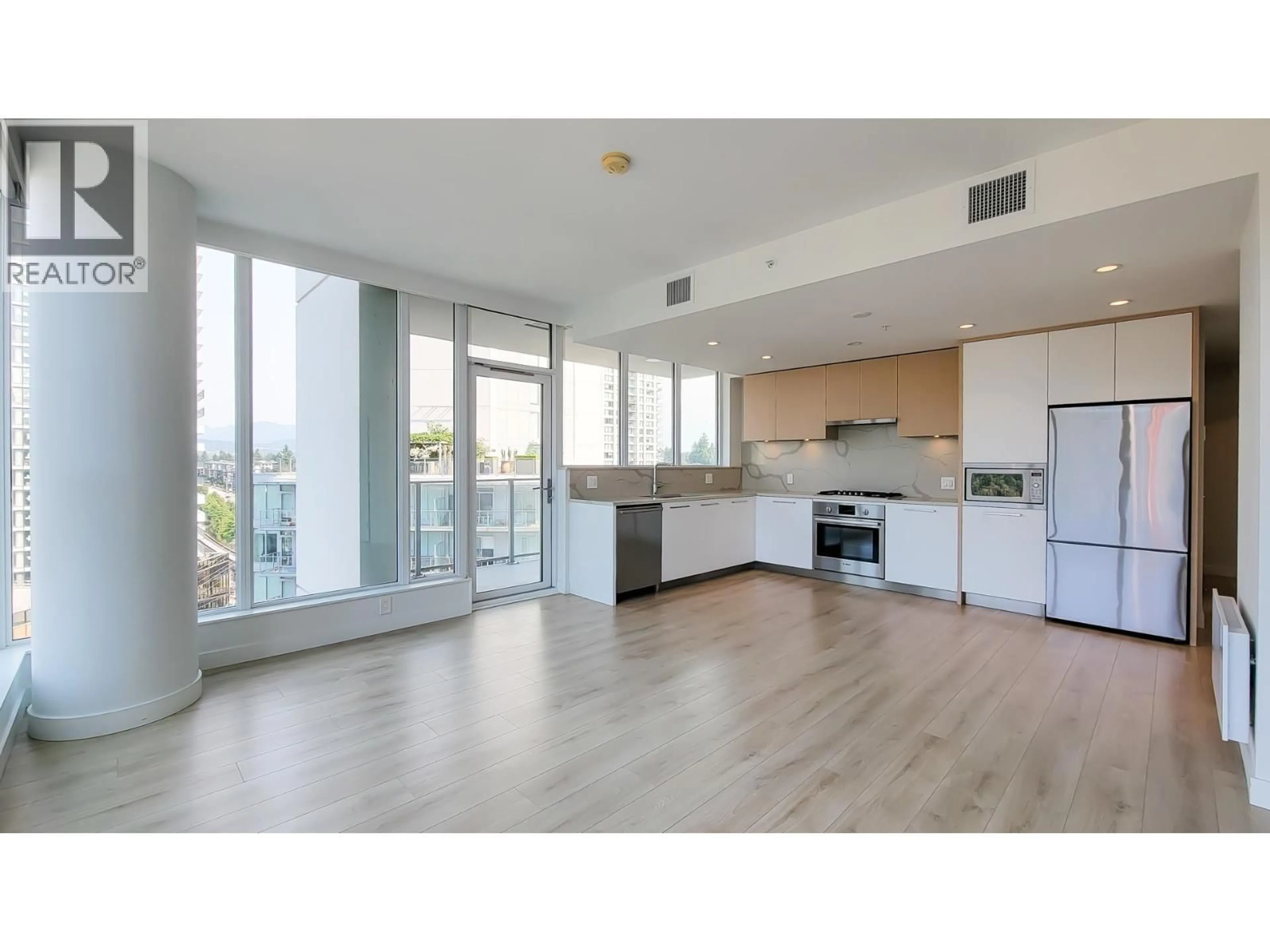 Open concept kitchen, wood/laminate floor for 1105 - 567 CLARKE ROAD, Coquitlam British Columbia V3J0K7
