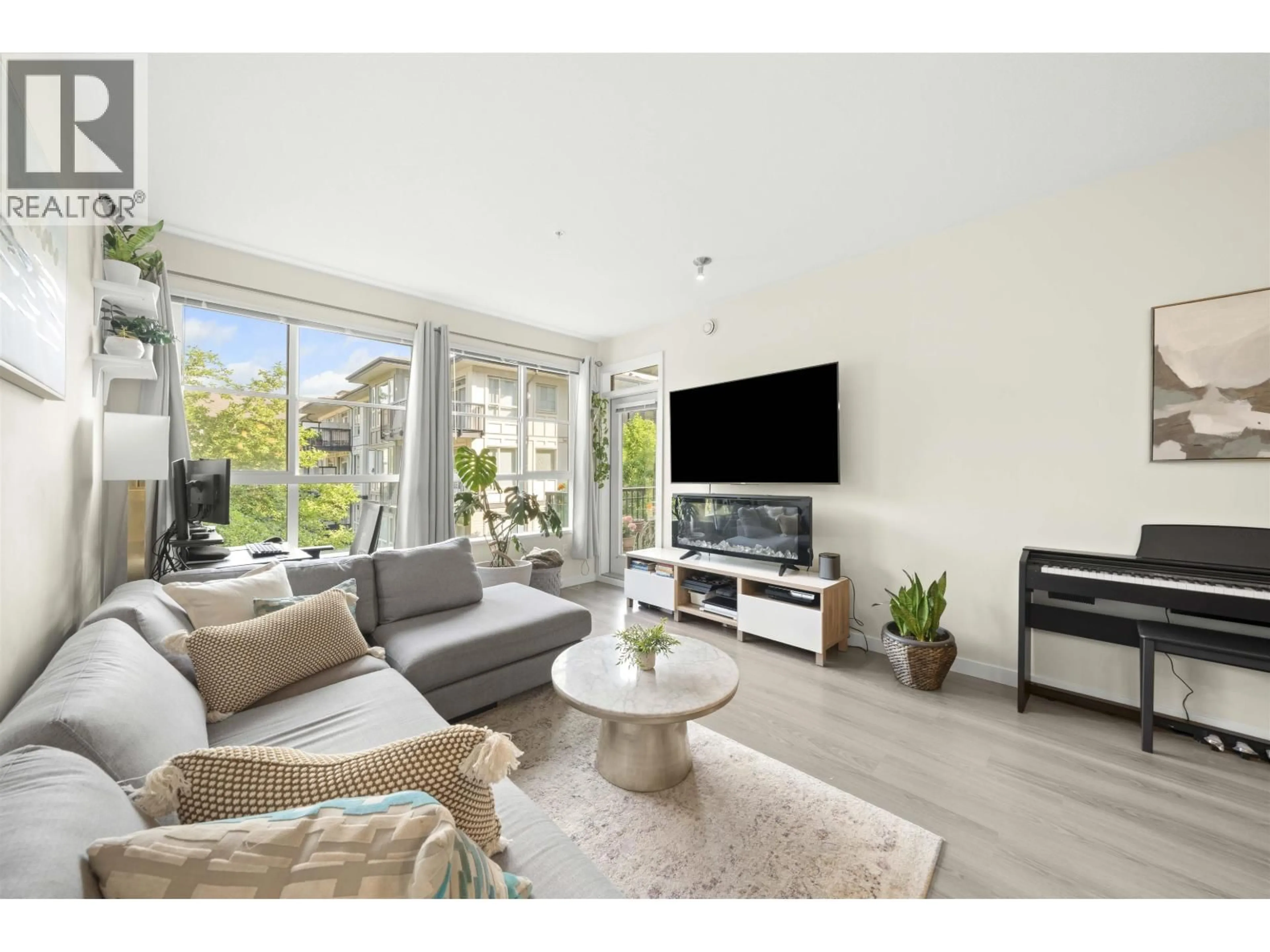 Living room with furniture, wood/laminate floor for 306 - 1152 WINDSOR MEWS, Coquitlam British Columbia V3B0N1