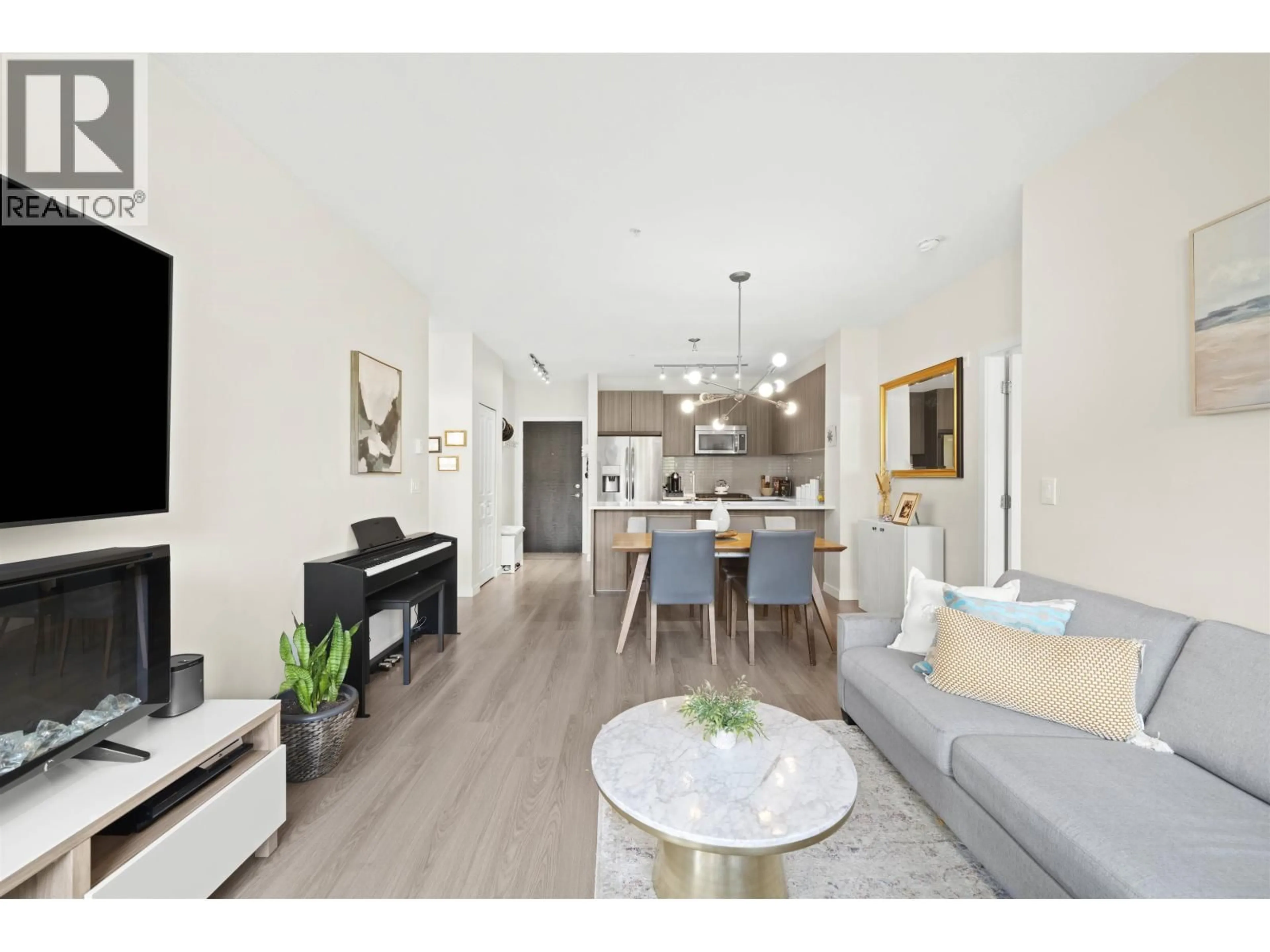 Living room with furniture, wood/laminate floor for 306 - 1152 WINDSOR MEWS, Coquitlam British Columbia V3B0N1