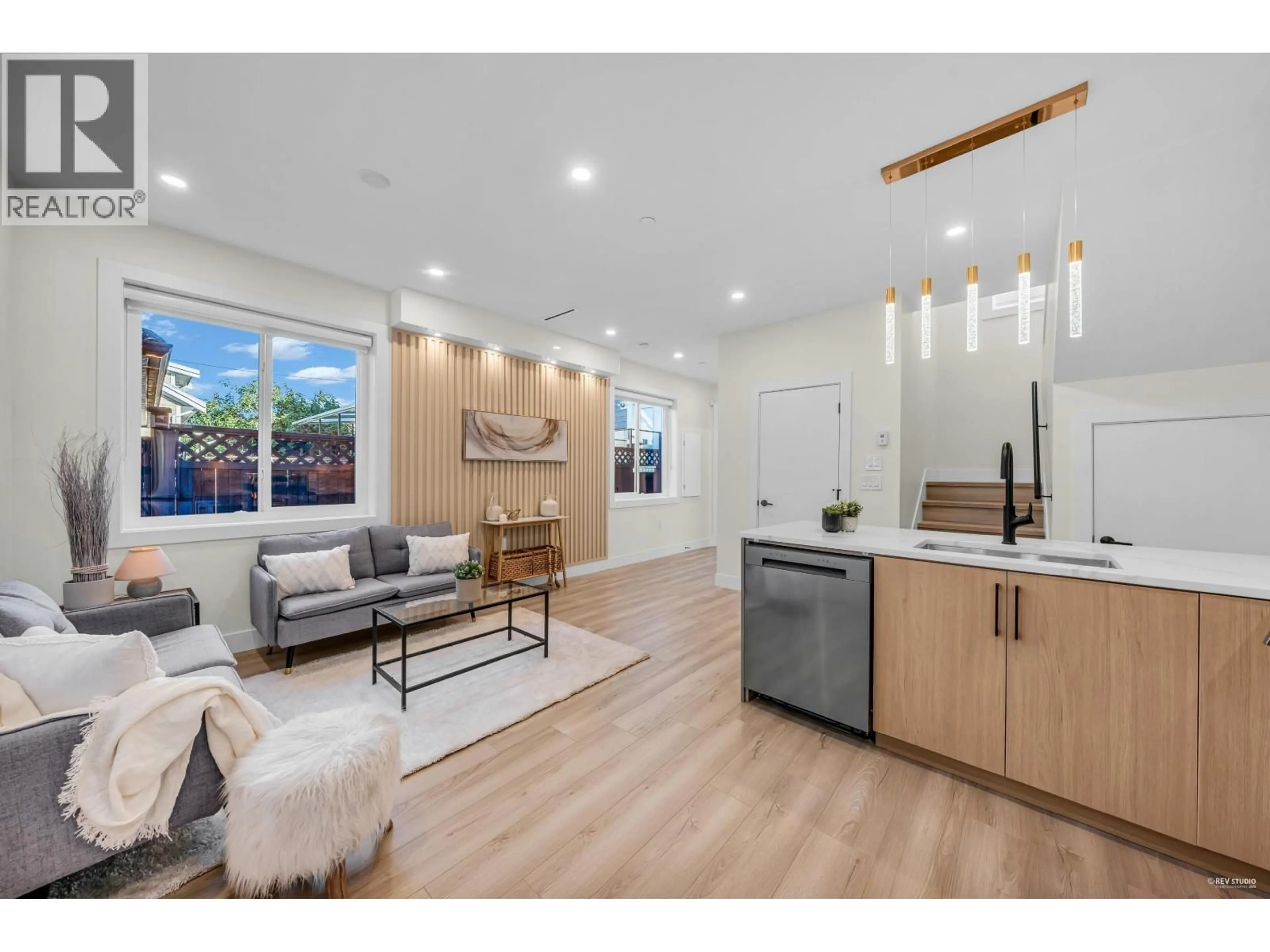 Open concept kitchen, wood/laminate floor for 2 - 2703 EAST 3RD AVENUE, Vancouver British Columbia V5M1H3