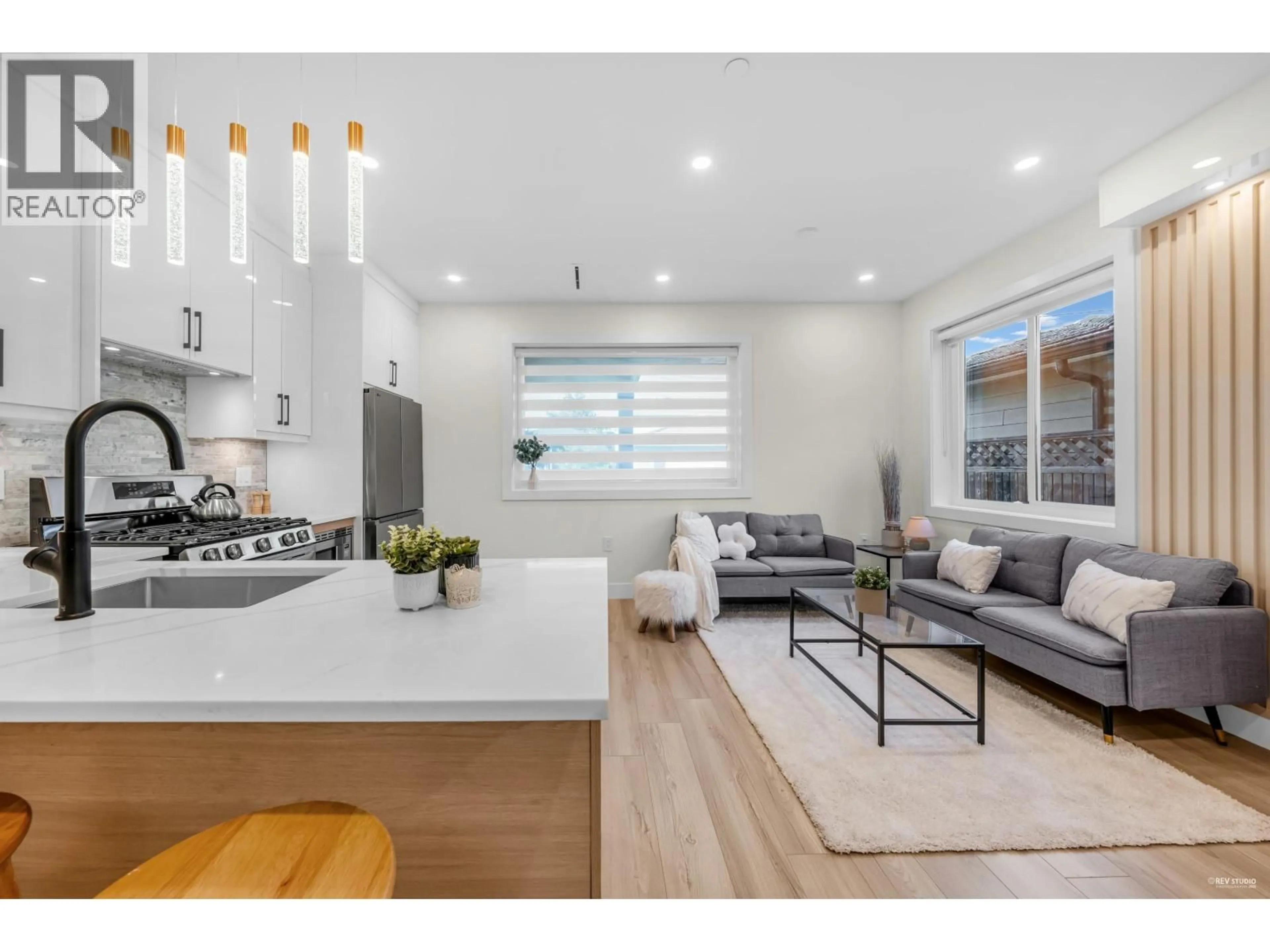 Open concept kitchen, wood/laminate floor for 2 - 2703 EAST 3RD AVENUE, Vancouver British Columbia V5M1H3