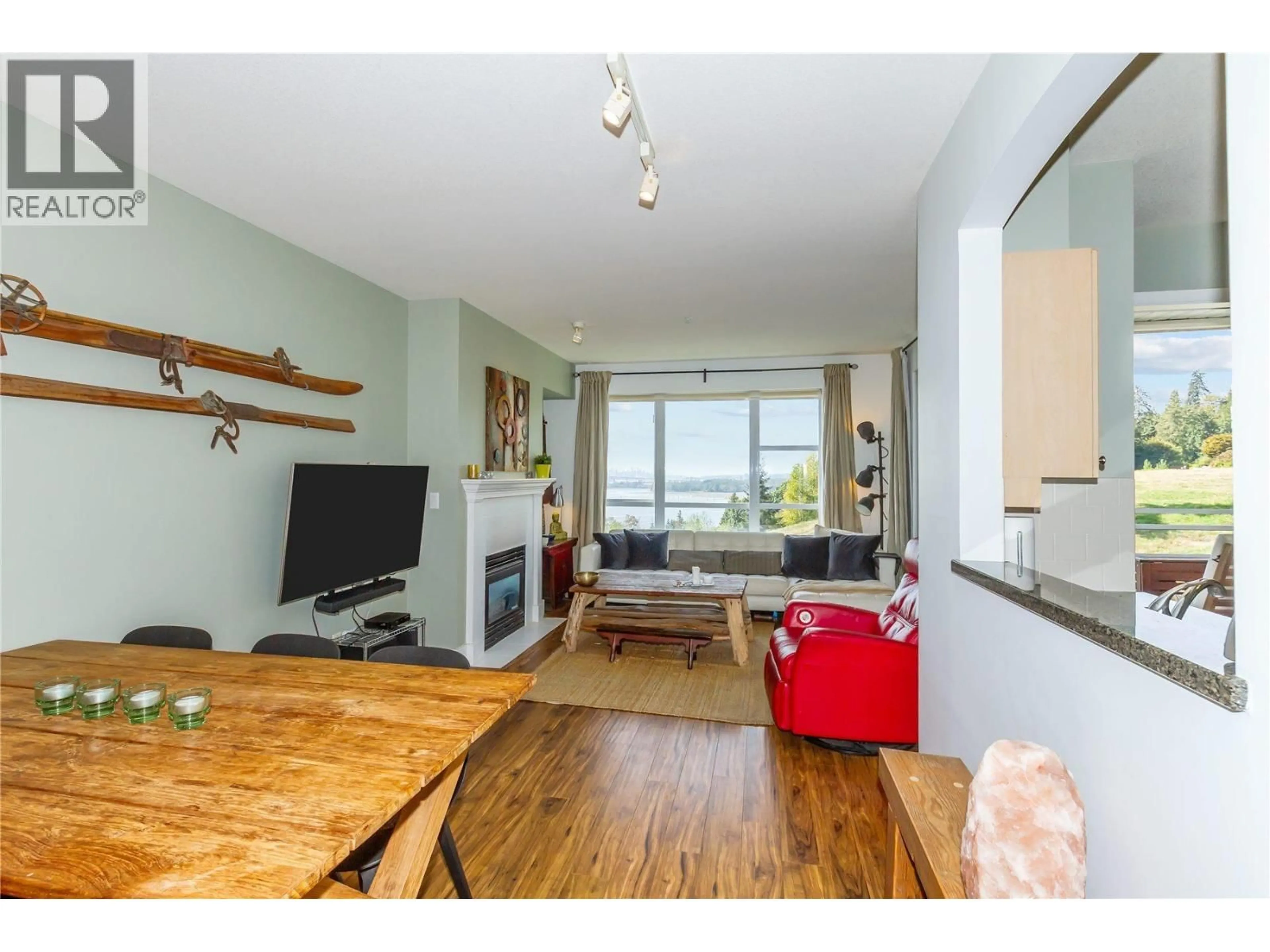 Living room with furniture, wood/laminate floor for 302 - 3608 DEERCREST DRIVE, North Vancouver British Columbia V7G2S8