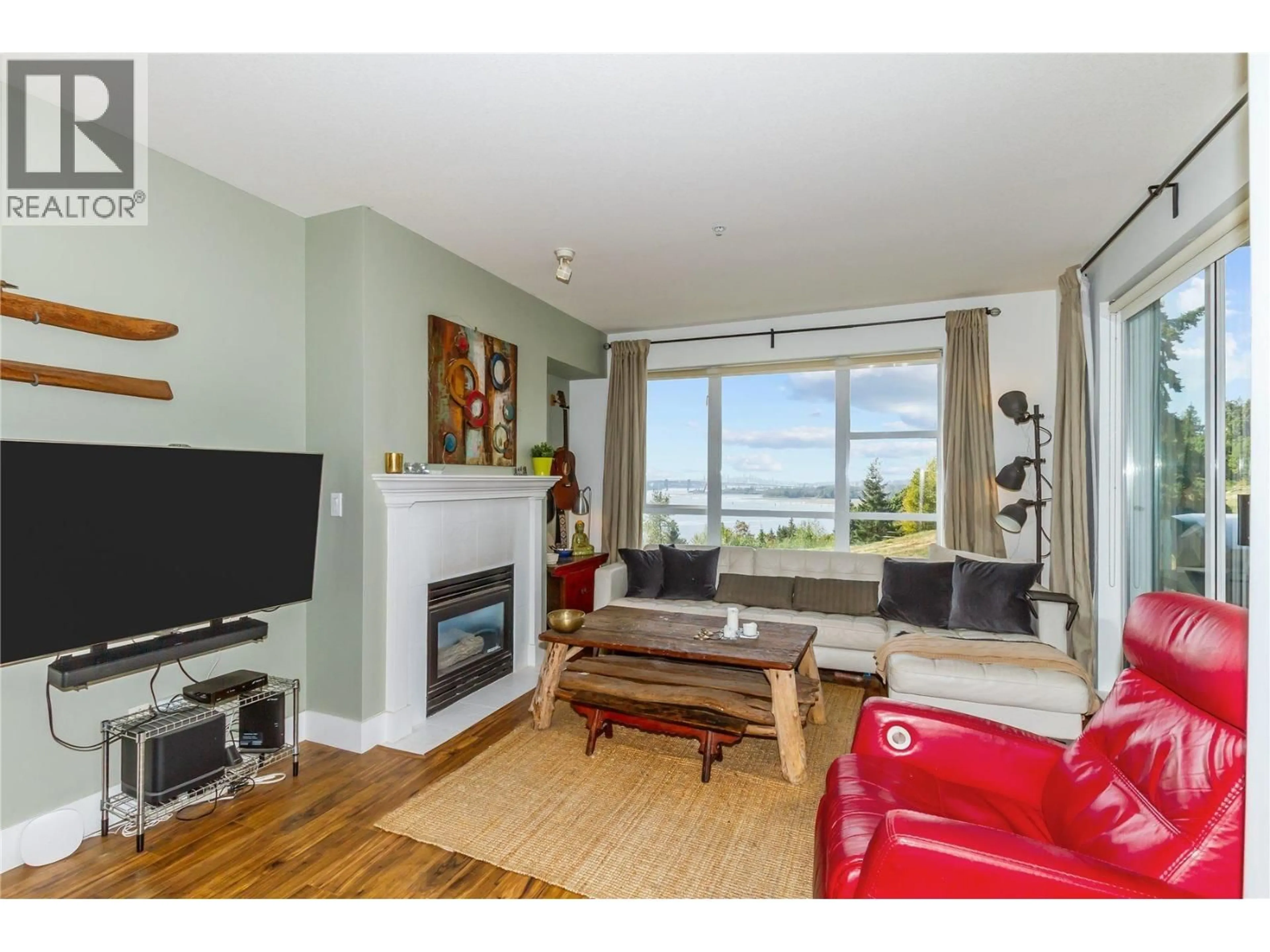 Living room with furniture, wood/laminate floor for 302 - 3608 DEERCREST DRIVE, North Vancouver British Columbia V7G2S8
