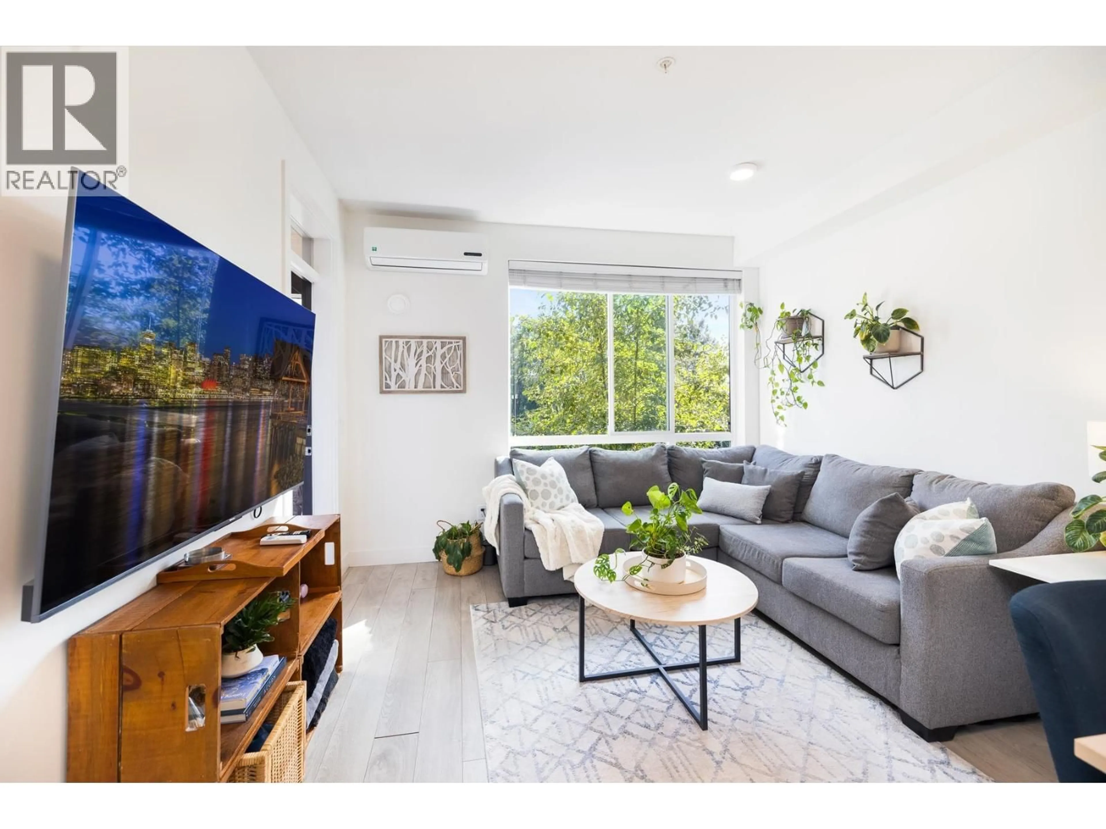Living room with furniture, unknown for 213 - 719 3RD STREET, North Vancouver British Columbia V7M0E7