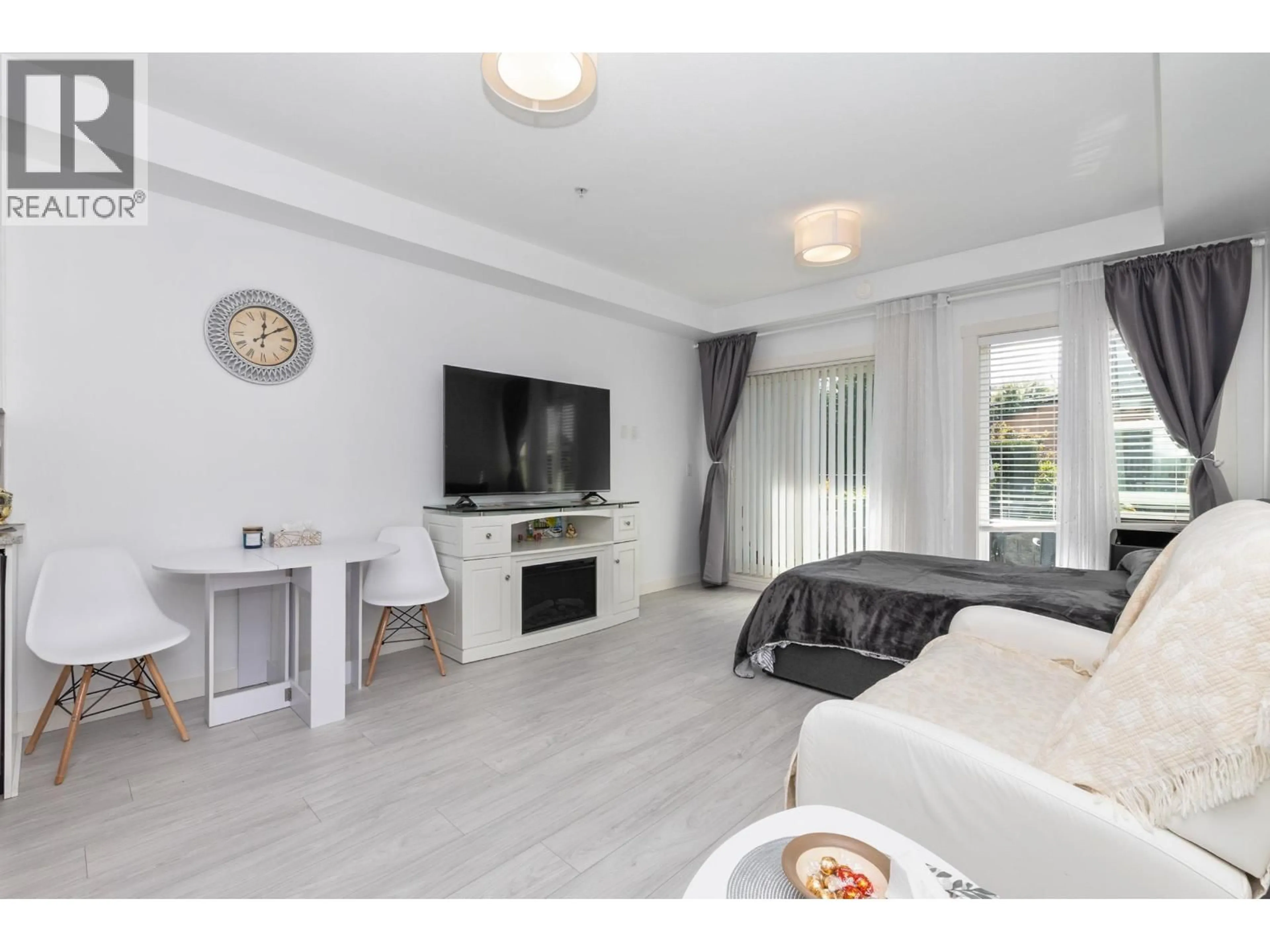 Living room with furniture, wood/laminate floor for 106 - 2356 WELCHER AVENUE, Port Coquitlam British Columbia V3C1X6