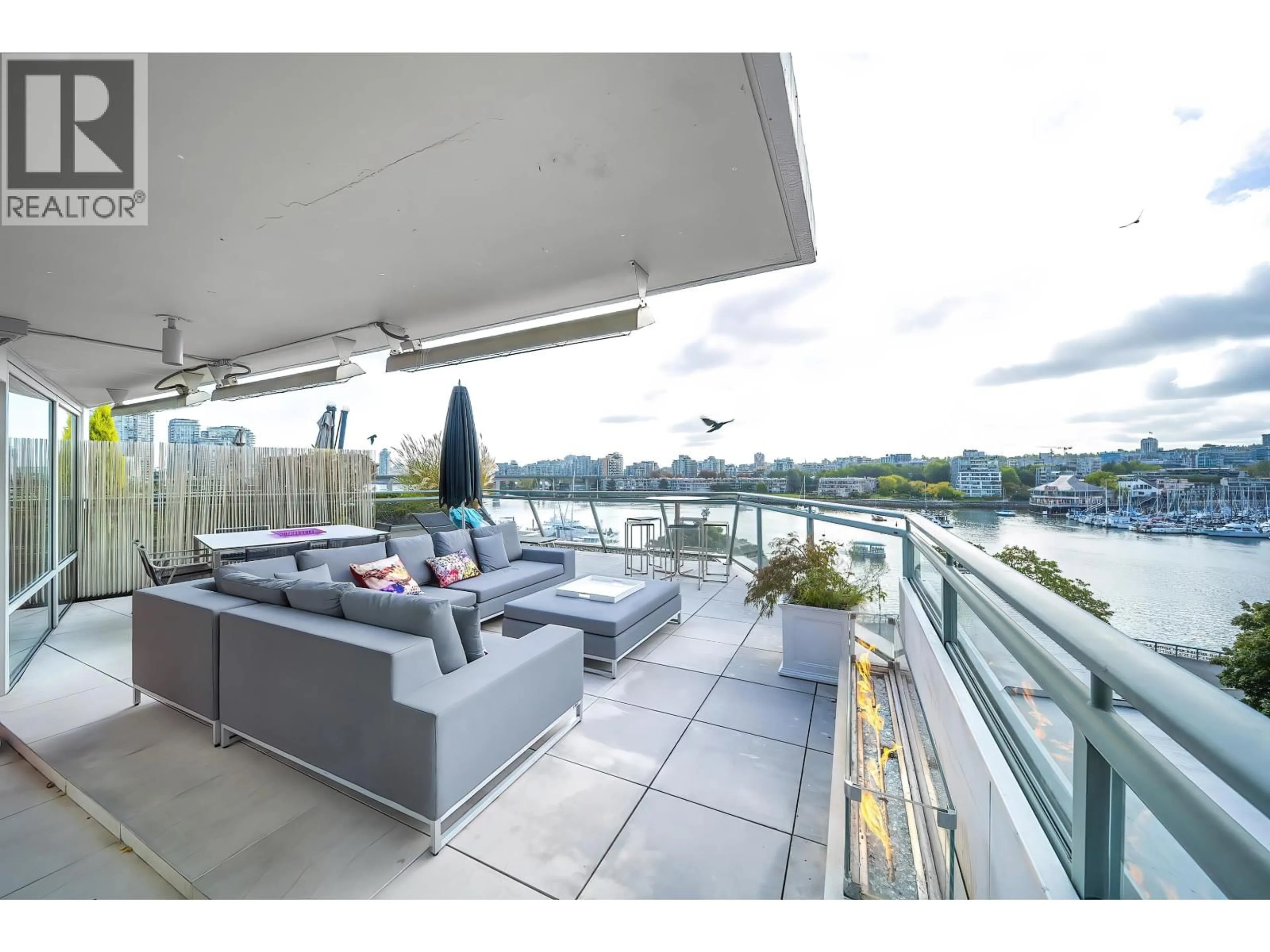 Patio, water/lake/river/ocean view for 606 - 1288 MARINASIDE CRESCENT, Vancouver British Columbia V6Z2W5
