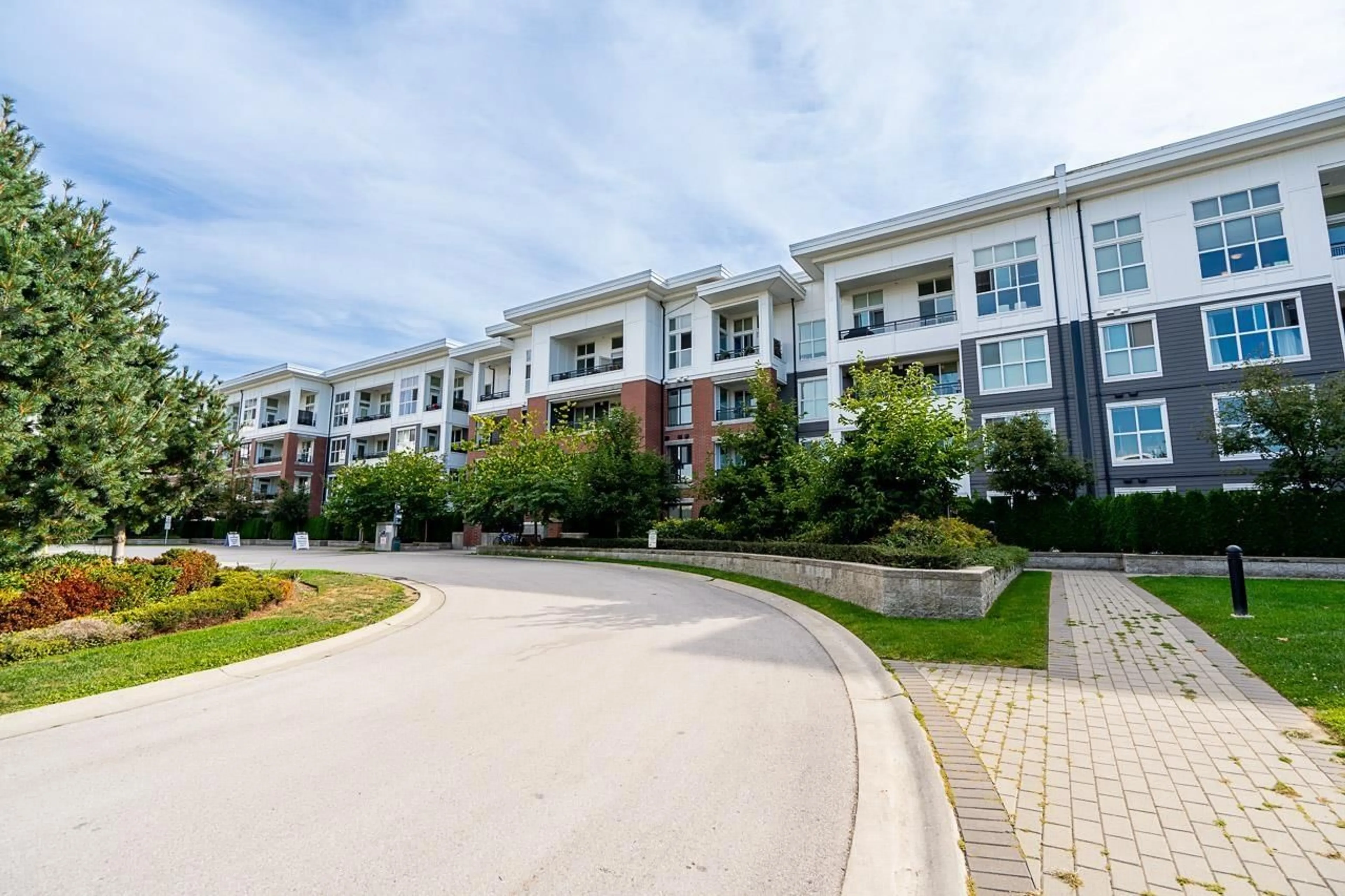 A pic from outside/outdoor area/front of a property/back of a property/a pic from drone, street for D111 - 8150 207, Langley British Columbia V2Y4J5
