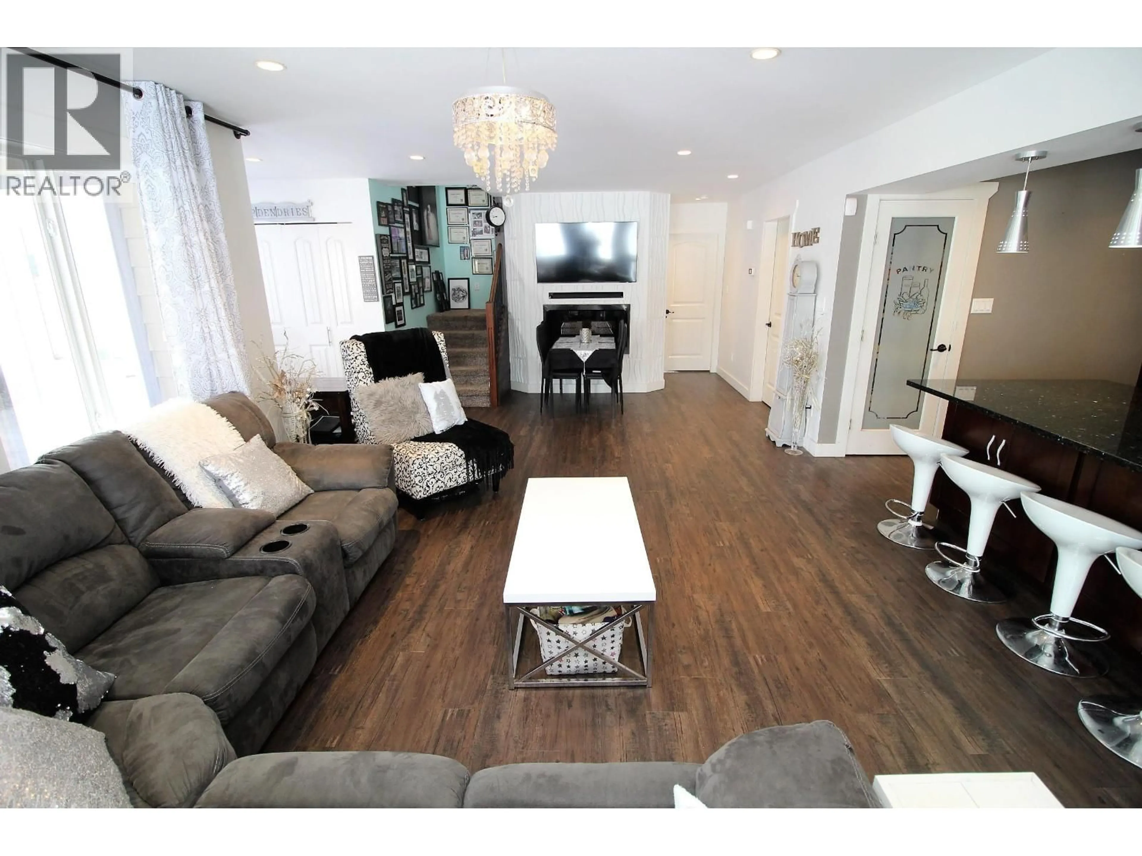 Living room with furniture, wood/laminate floor for 2233 LAW AVENUE, Houston British Columbia V0J1Z0