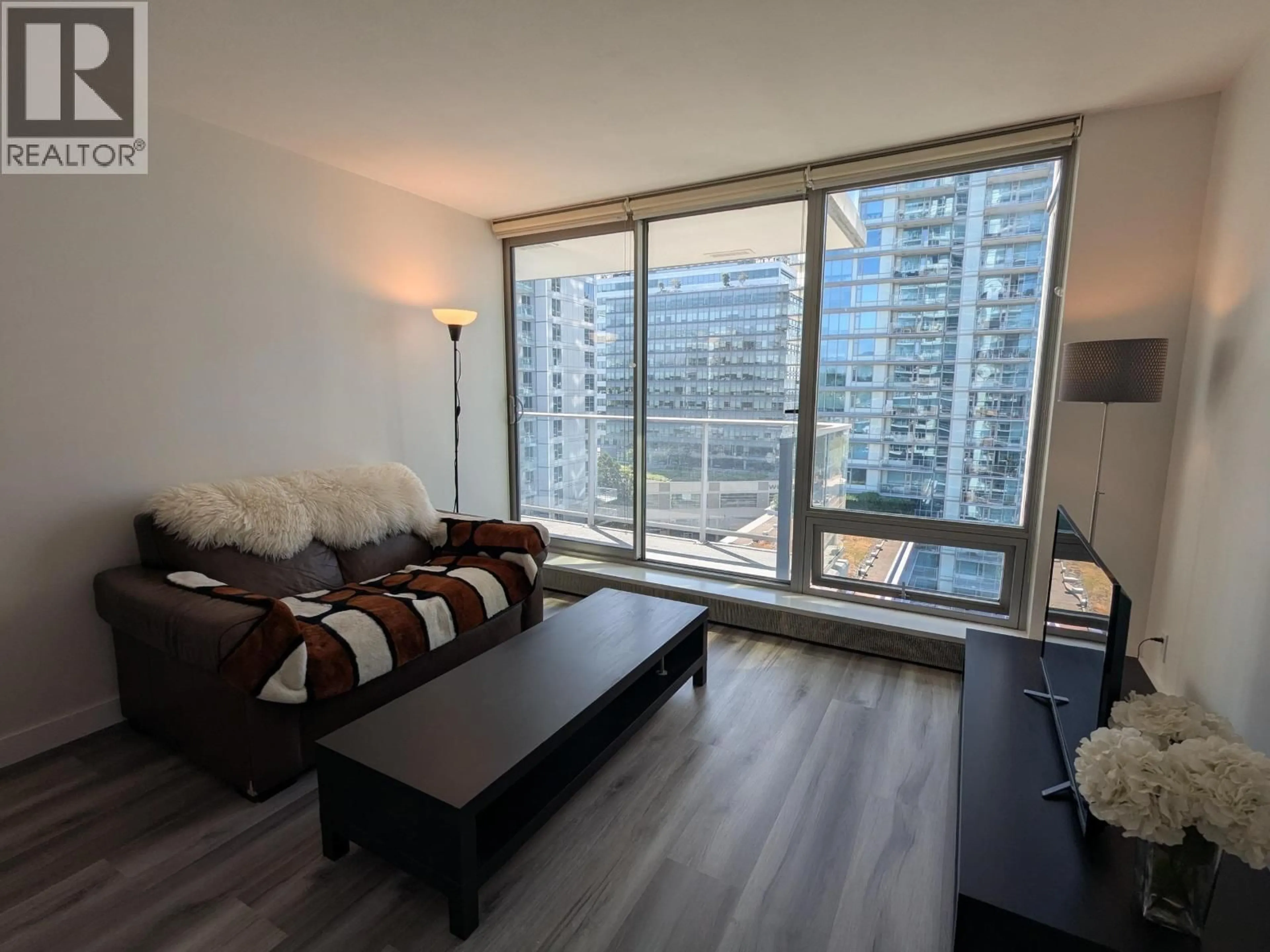 Living room with furniture, wood/laminate floor for 1107 - 8031 NUNAVUT LANE, Vancouver British Columbia V5X0C9