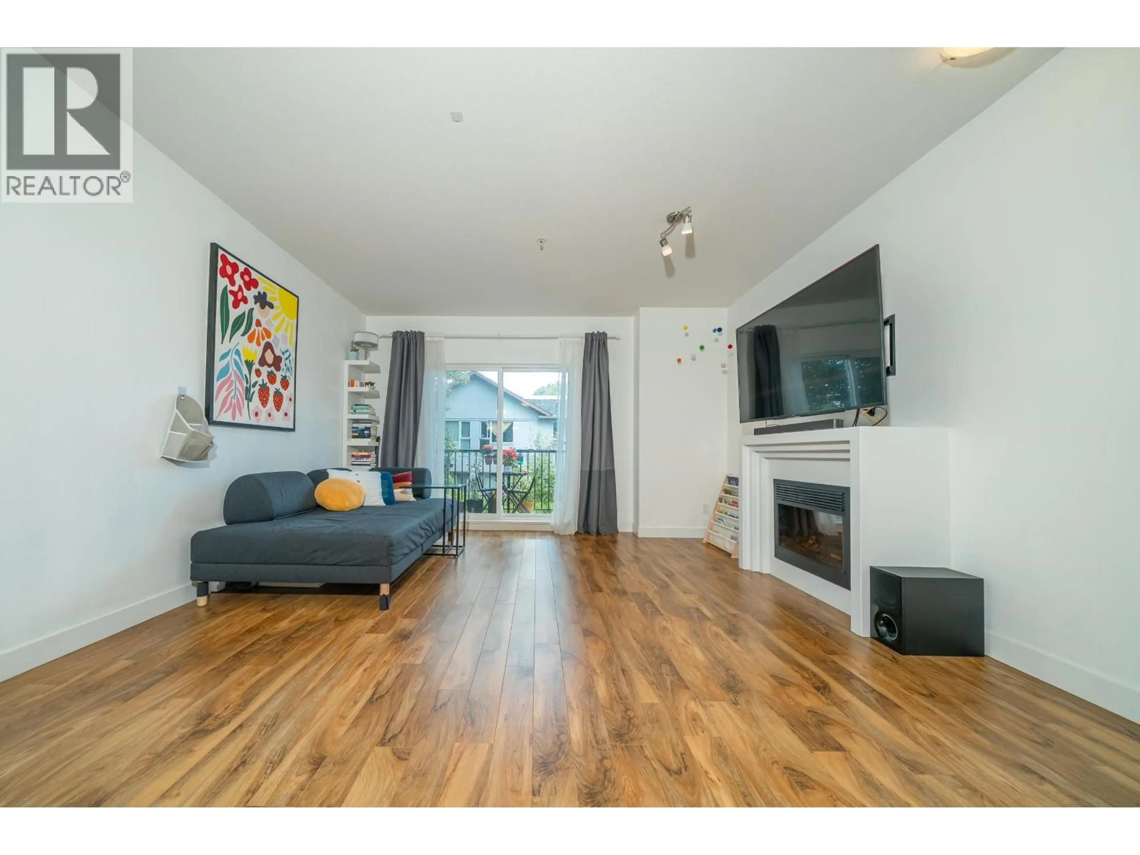 Living room with furniture, wood/laminate floor for 227 - 3888 NORFOLK STREET, Burnaby British Columbia V5G1E5