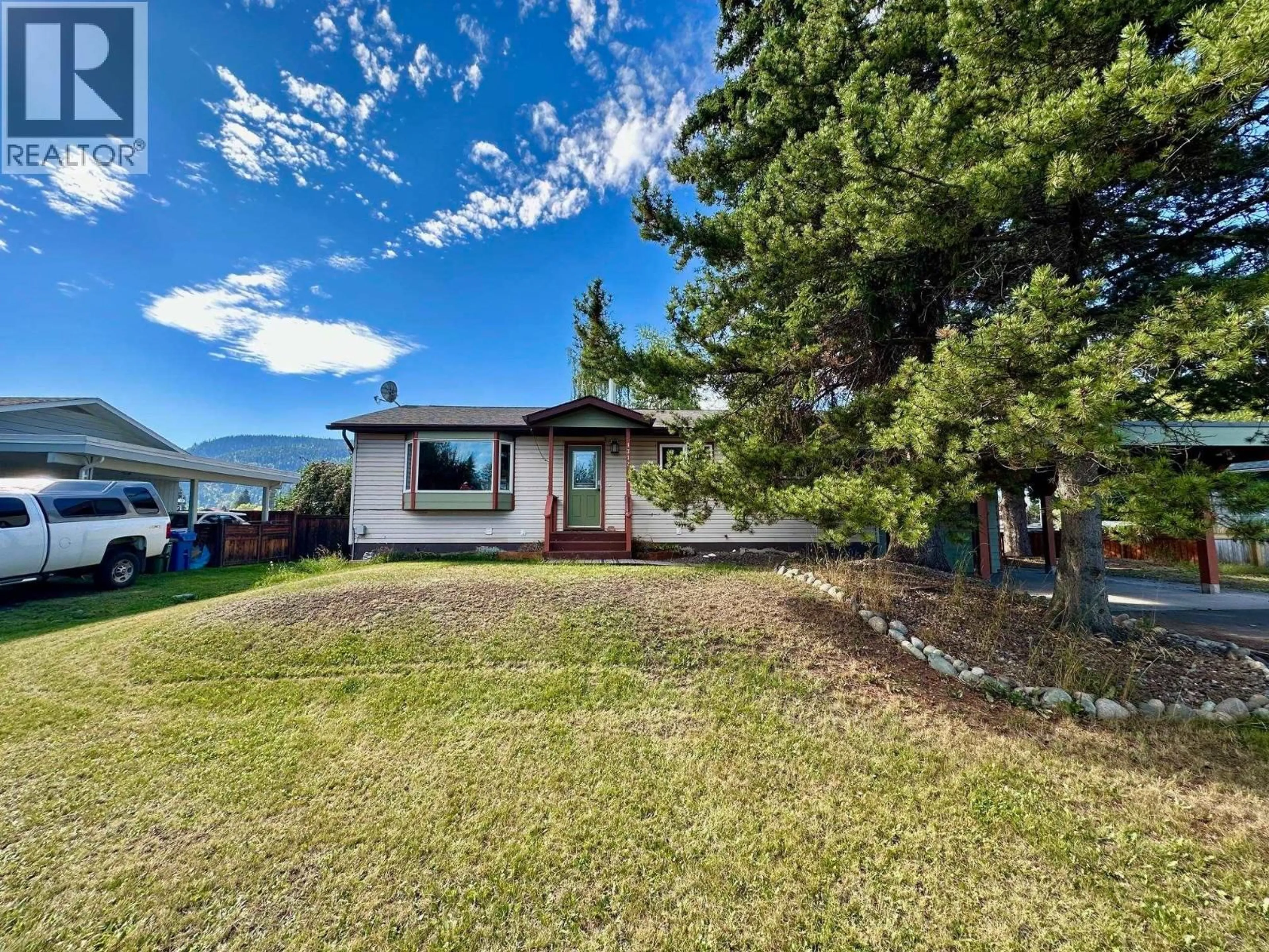 A pic from outside/outdoor area/front of a property/back of a property/a pic from drone, mountain view for 1312 MORICE DRIVE, Smithers British Columbia V0J2N0