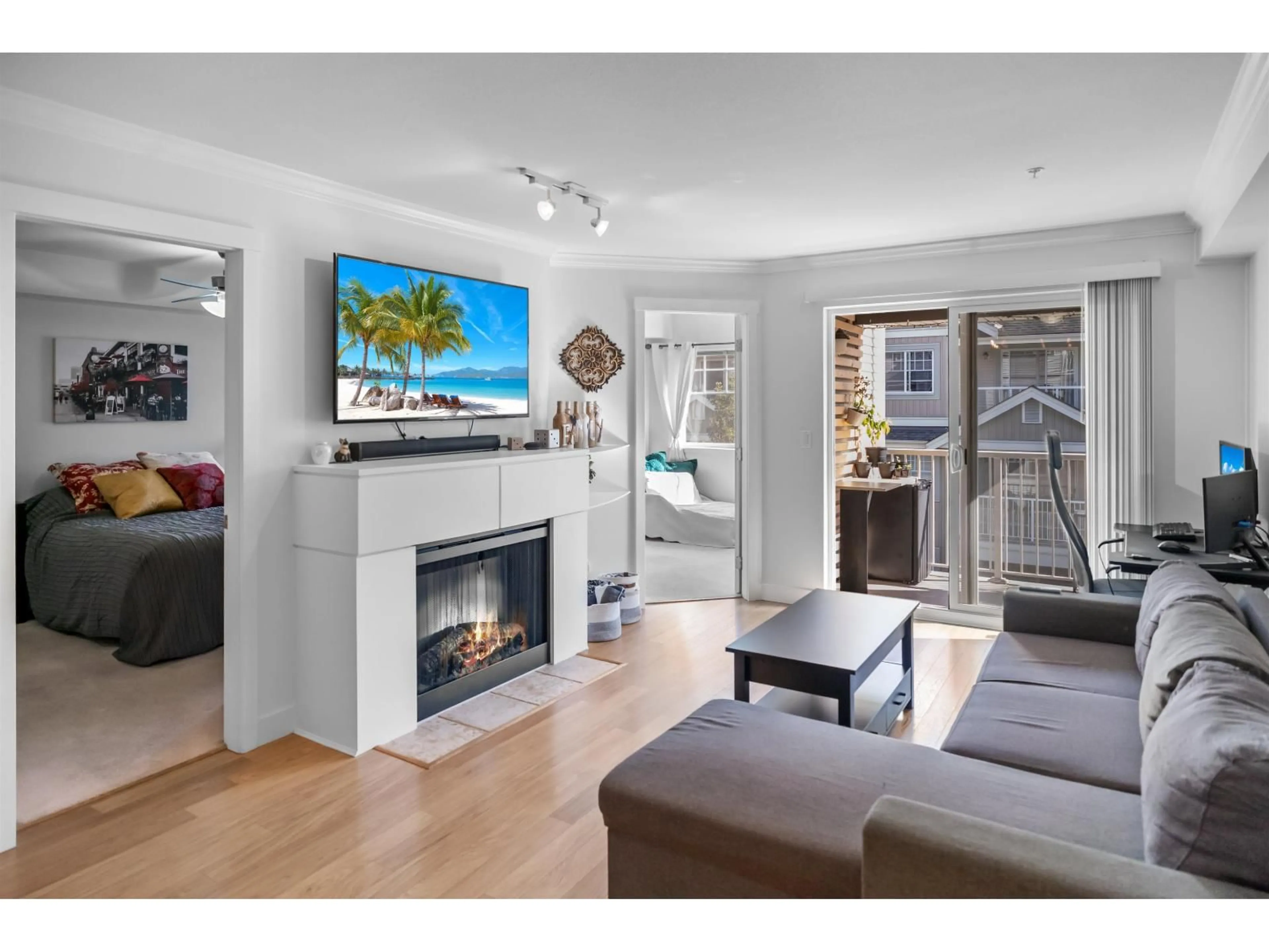 Living room with furniture, wood/laminate floor for 307 - 19340 65, Surrey British Columbia V4N0A3