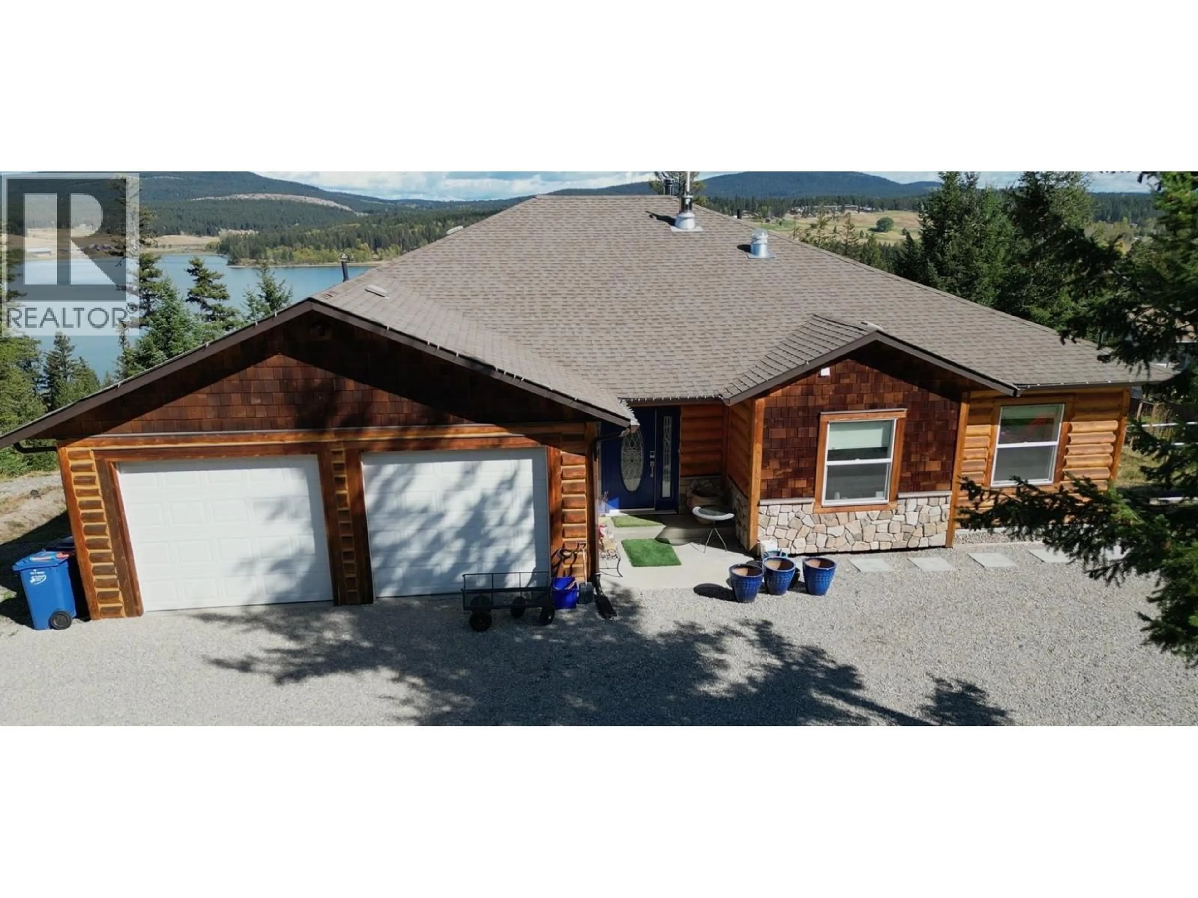 A pic from outside/outdoor area/front of a property/back of a property/a pic from drone, mountain view for 4849 BRYAN CRESCENT, 108 Mile Ranch British Columbia V0K2Z0
