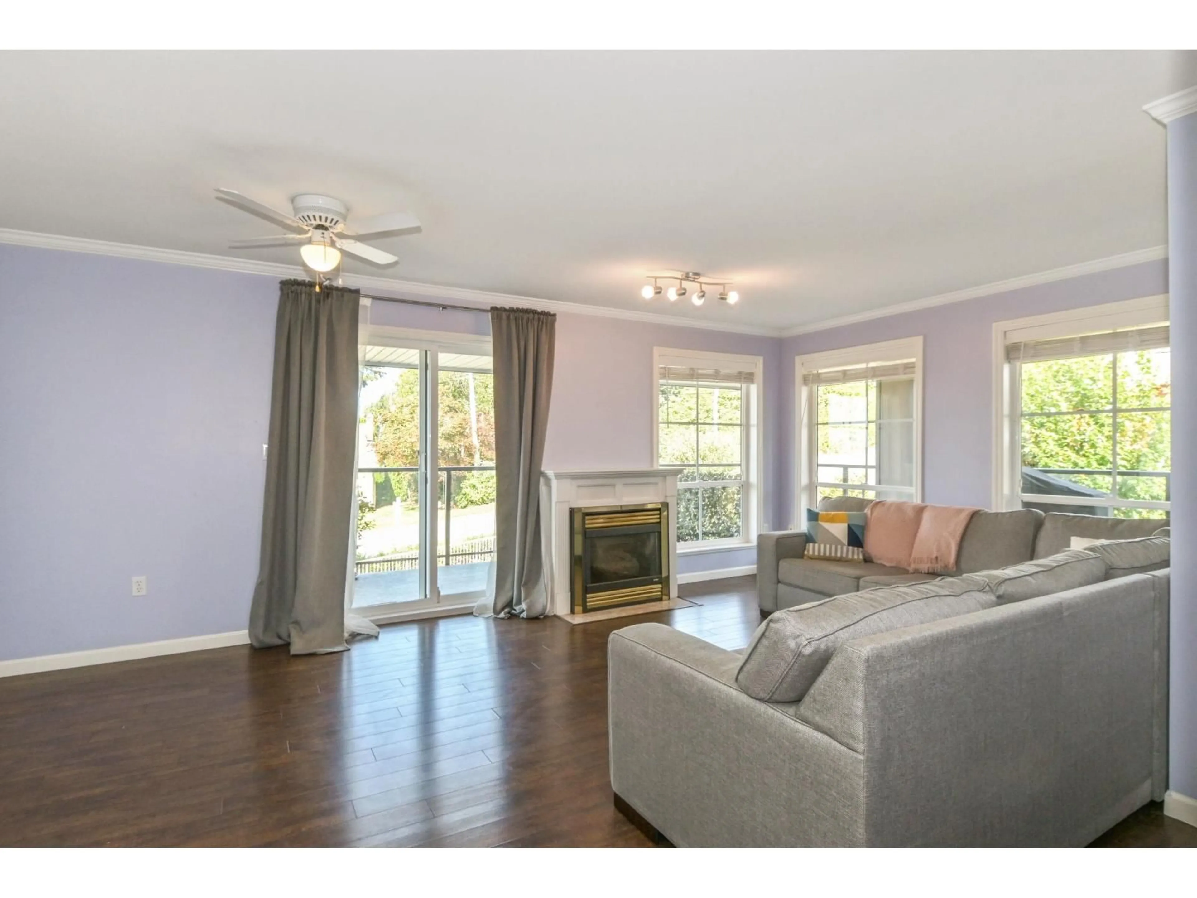 Living room with furniture, wood/laminate floor for 213 - 33150 4, Mission British Columbia V2V7A3