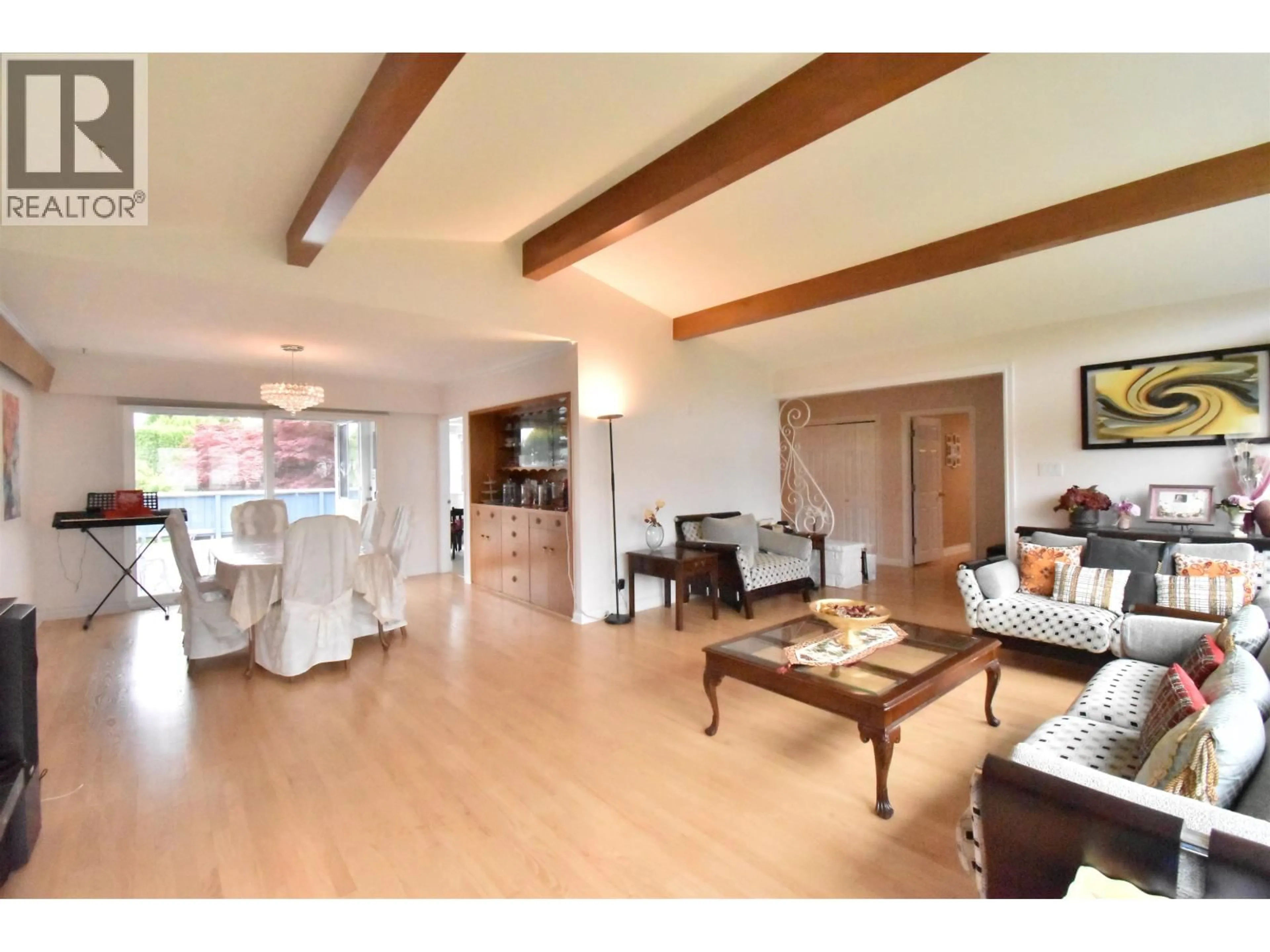 Living room with furniture, wood/laminate floor for 7155 ELMHURST DRIVE, Vancouver British Columbia V5S2X5