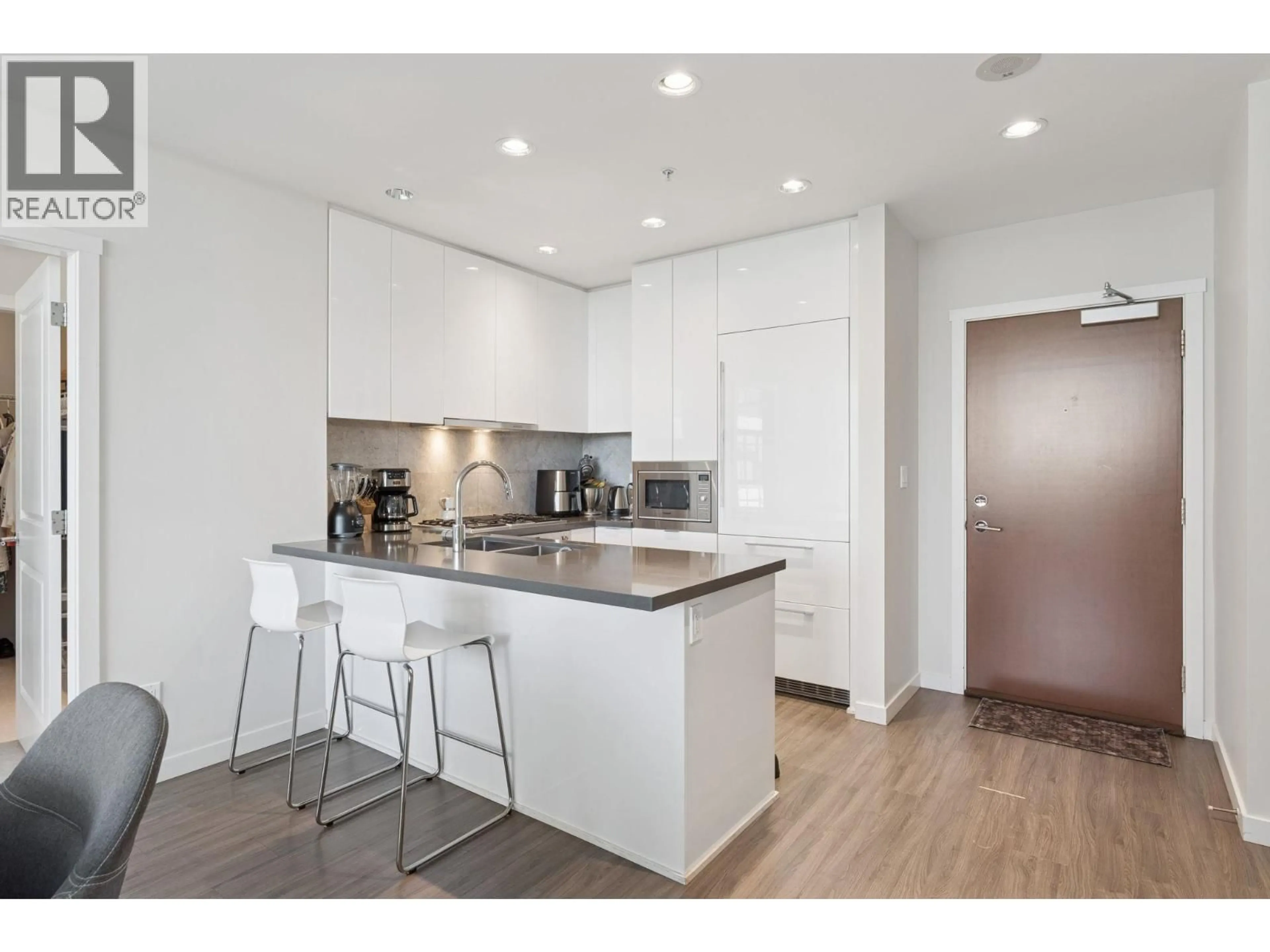 Open concept kitchen, wood/laminate floor for 1017 - 7338 GOLLNER AVENUE, Richmond British Columbia V6Y0H8