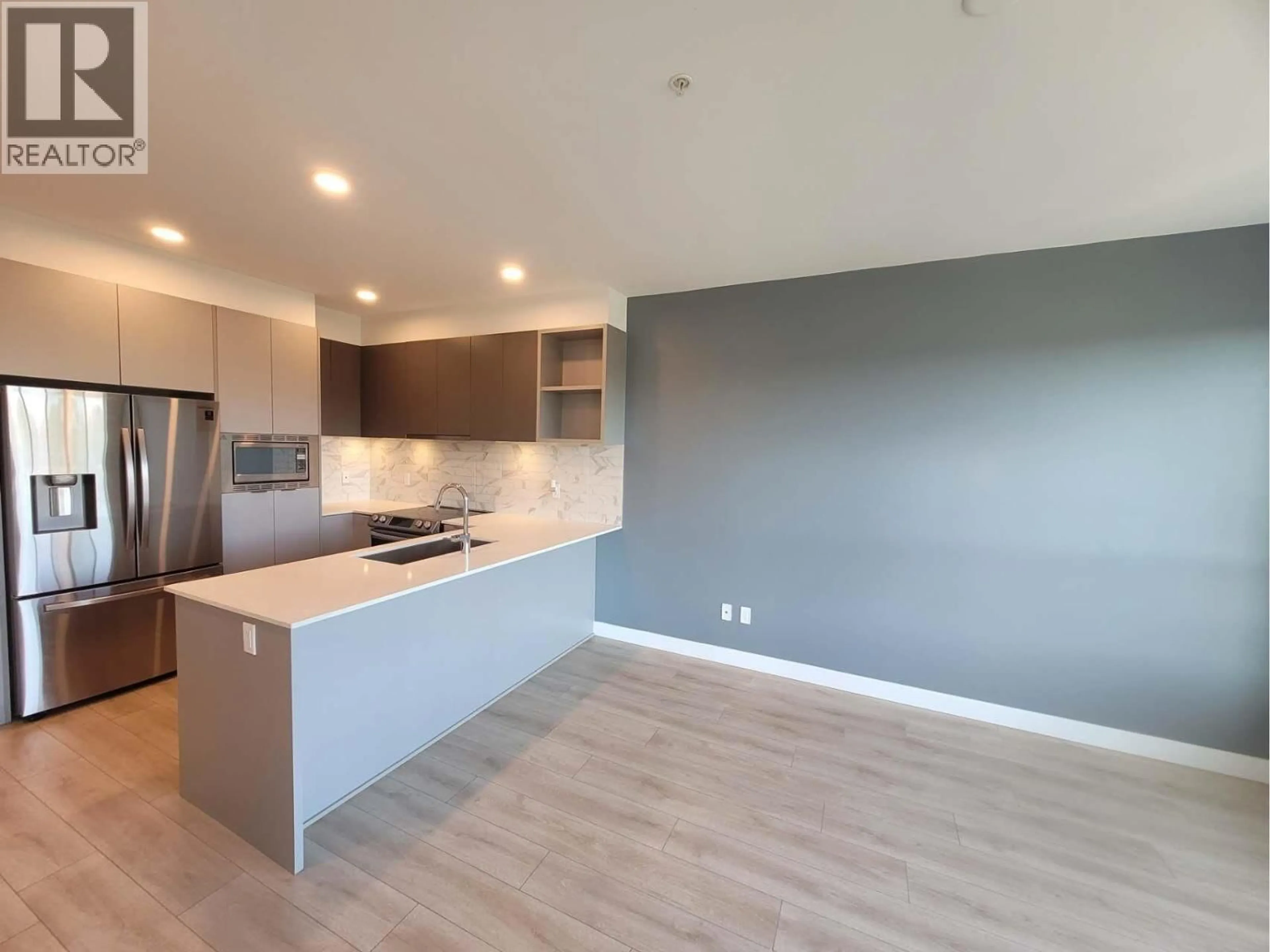 Open concept kitchen, wood/laminate floor for 224 - 1792 STARLING DRIVE, Tsawwassen British Columbia V4M0E4