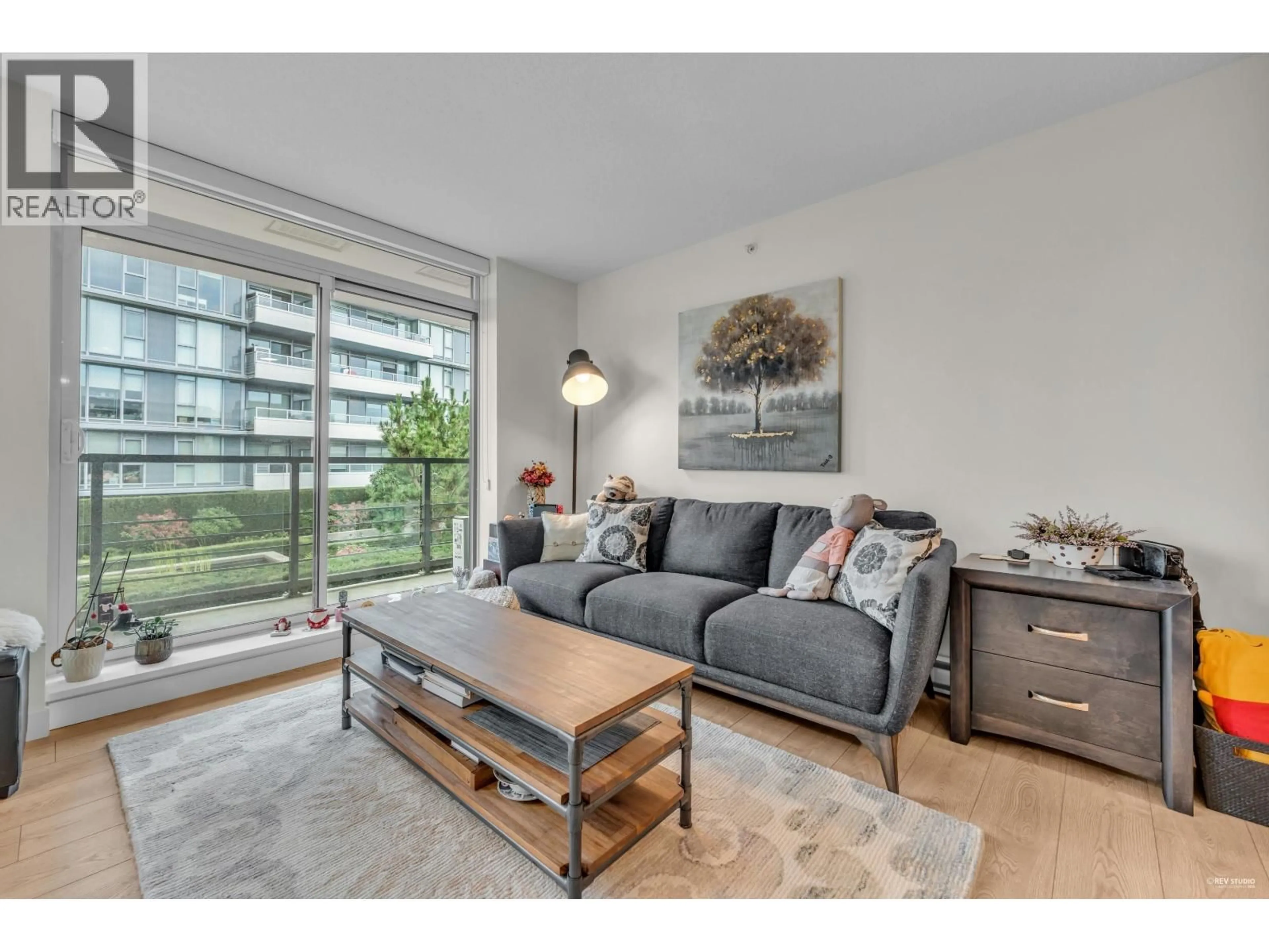 Living room with furniture, wood/laminate floor for 603 - 9019 COOK ROAD, Richmond British Columbia V6Y0G6