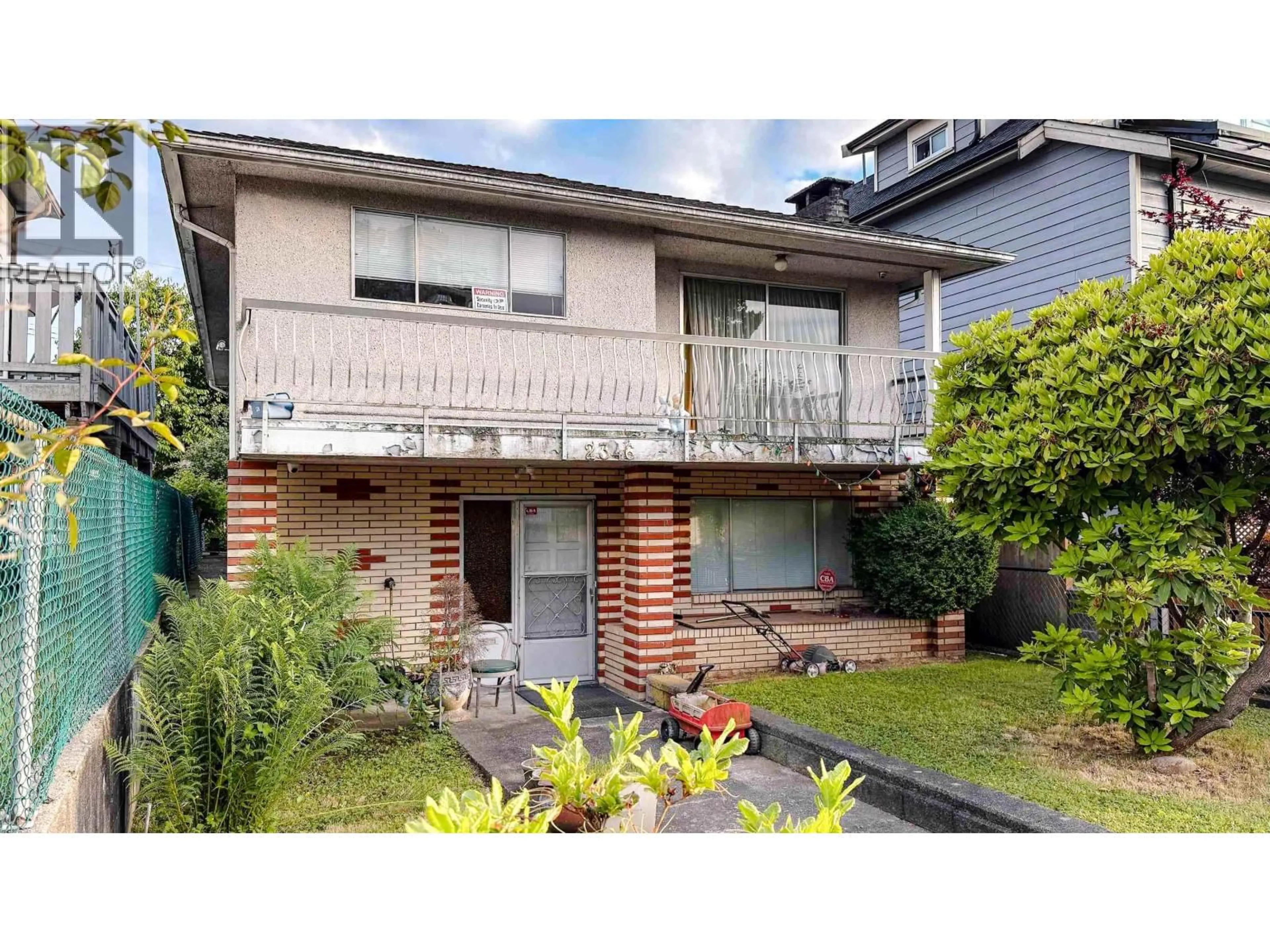 Home with brick exterior material, street for 2346 33RD AVENUE, Vancouver British Columbia V5R2S3
