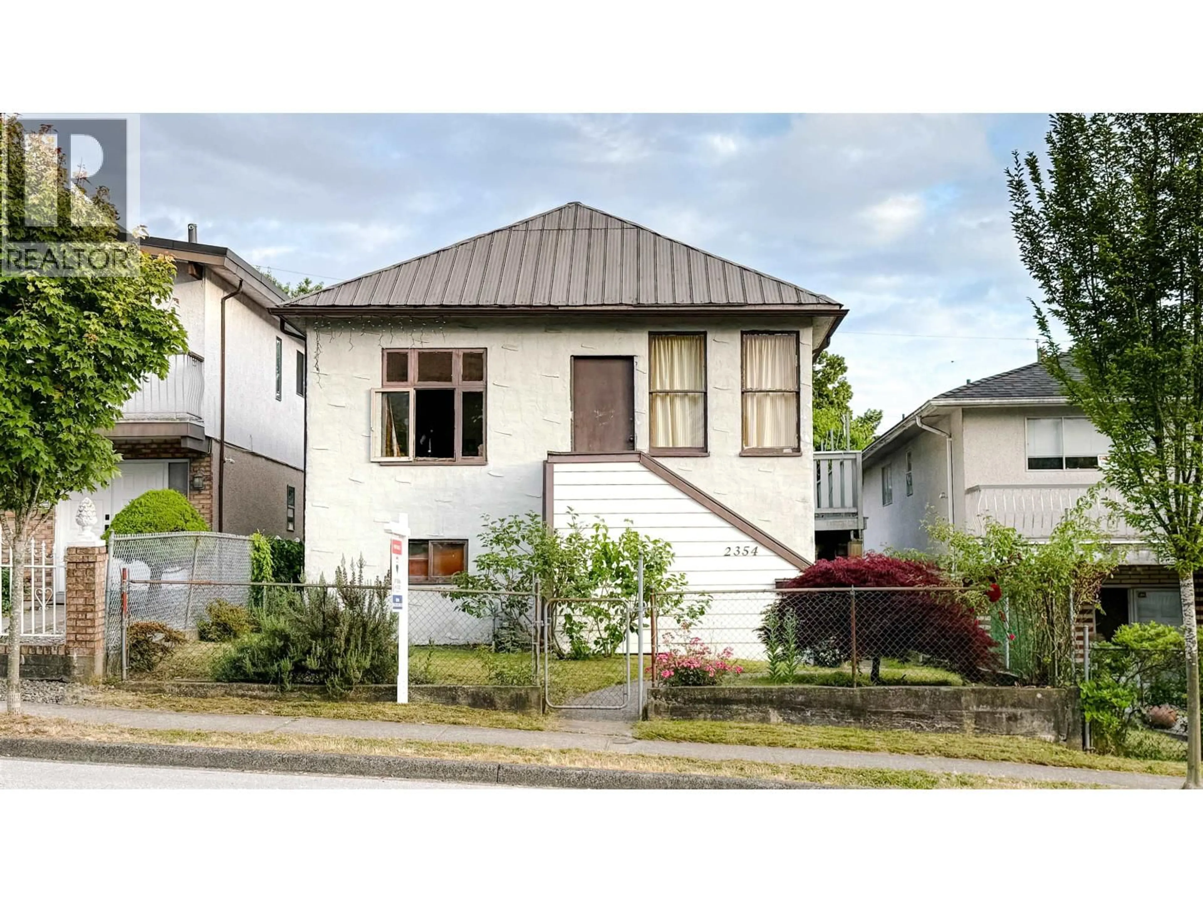 Home with vinyl exterior material, street for 2354 33RD AVENUE, Vancouver British Columbia V5R2S3