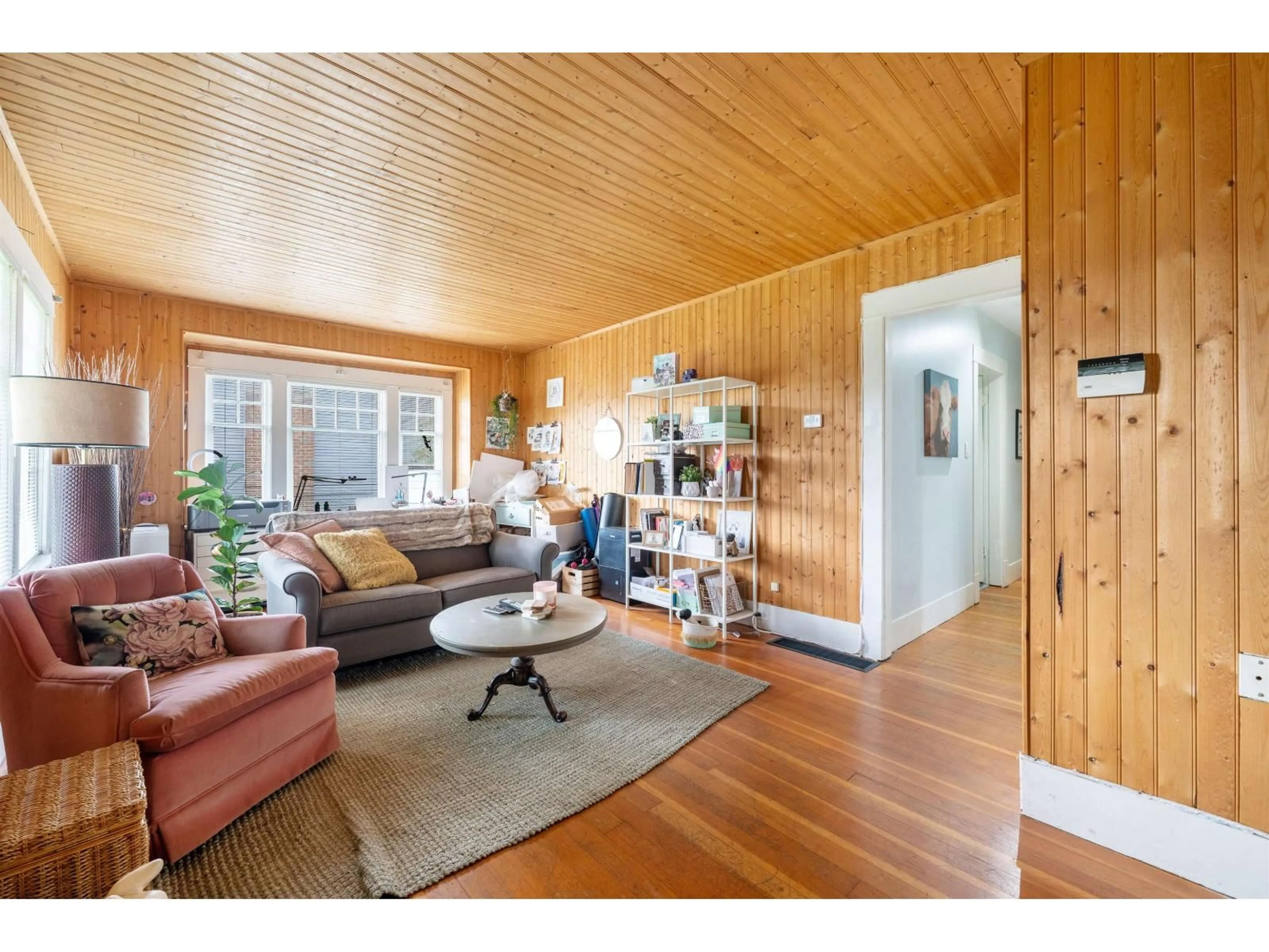 Living room with furniture, wood/laminate floor for 6119 176, Surrey British Columbia V3S4E8