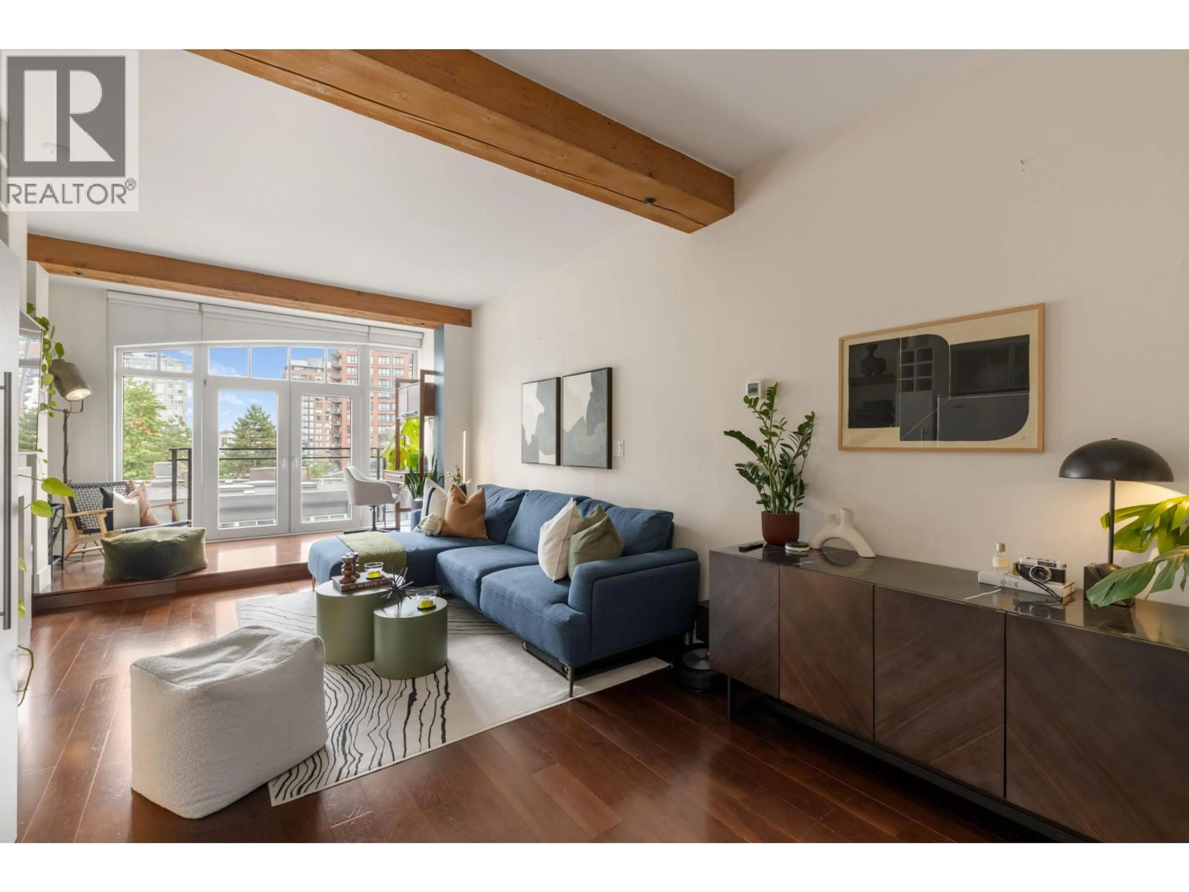 Living room with furniture, wood/laminate floor for 408 - 1275 HAMILTON STREET, Vancouver British Columbia V6B1E2