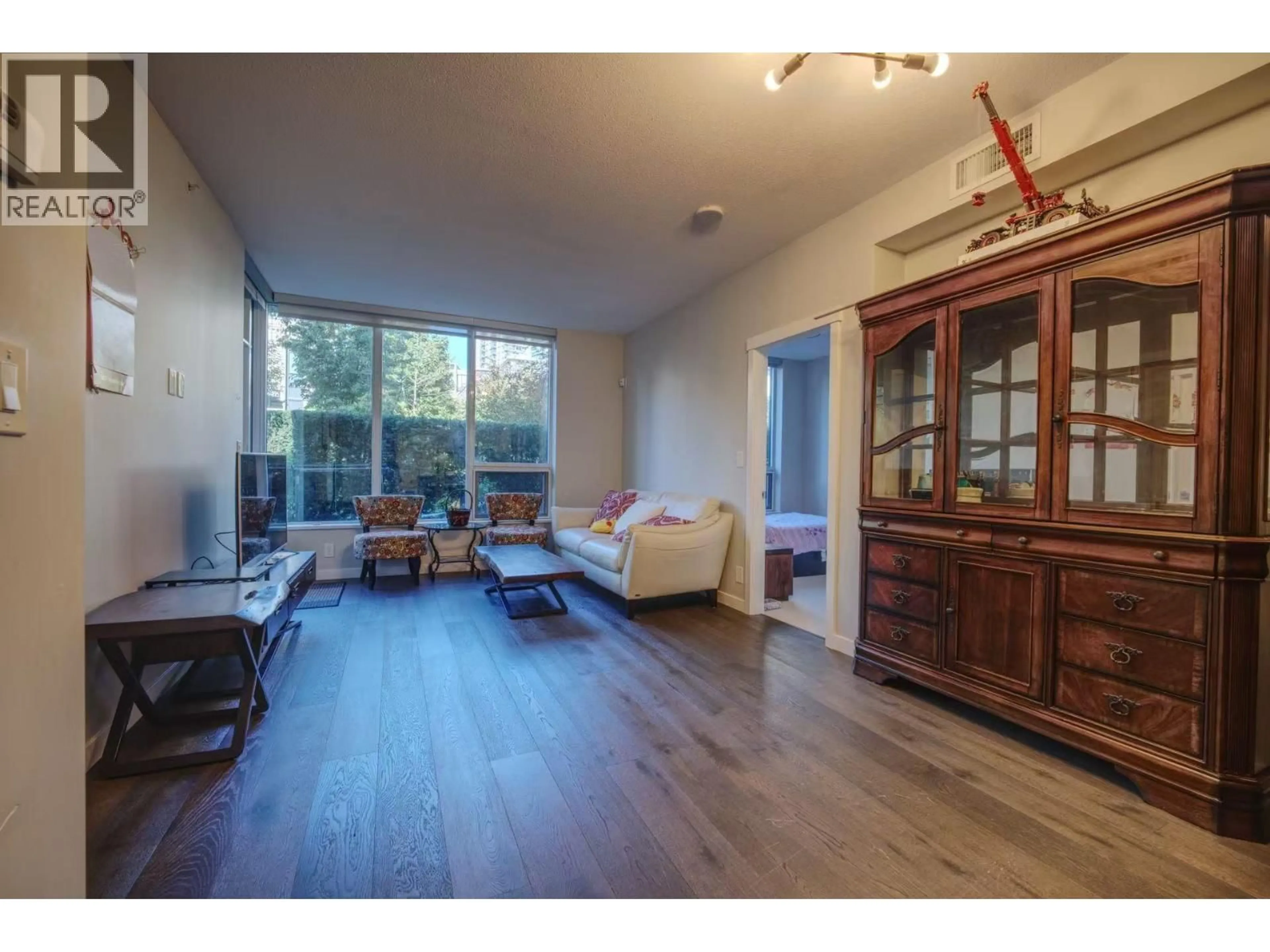 Living room with furniture, wood/laminate floor for 115 - 5687 GRAY AVENUE, Vancouver British Columbia V6S0K7