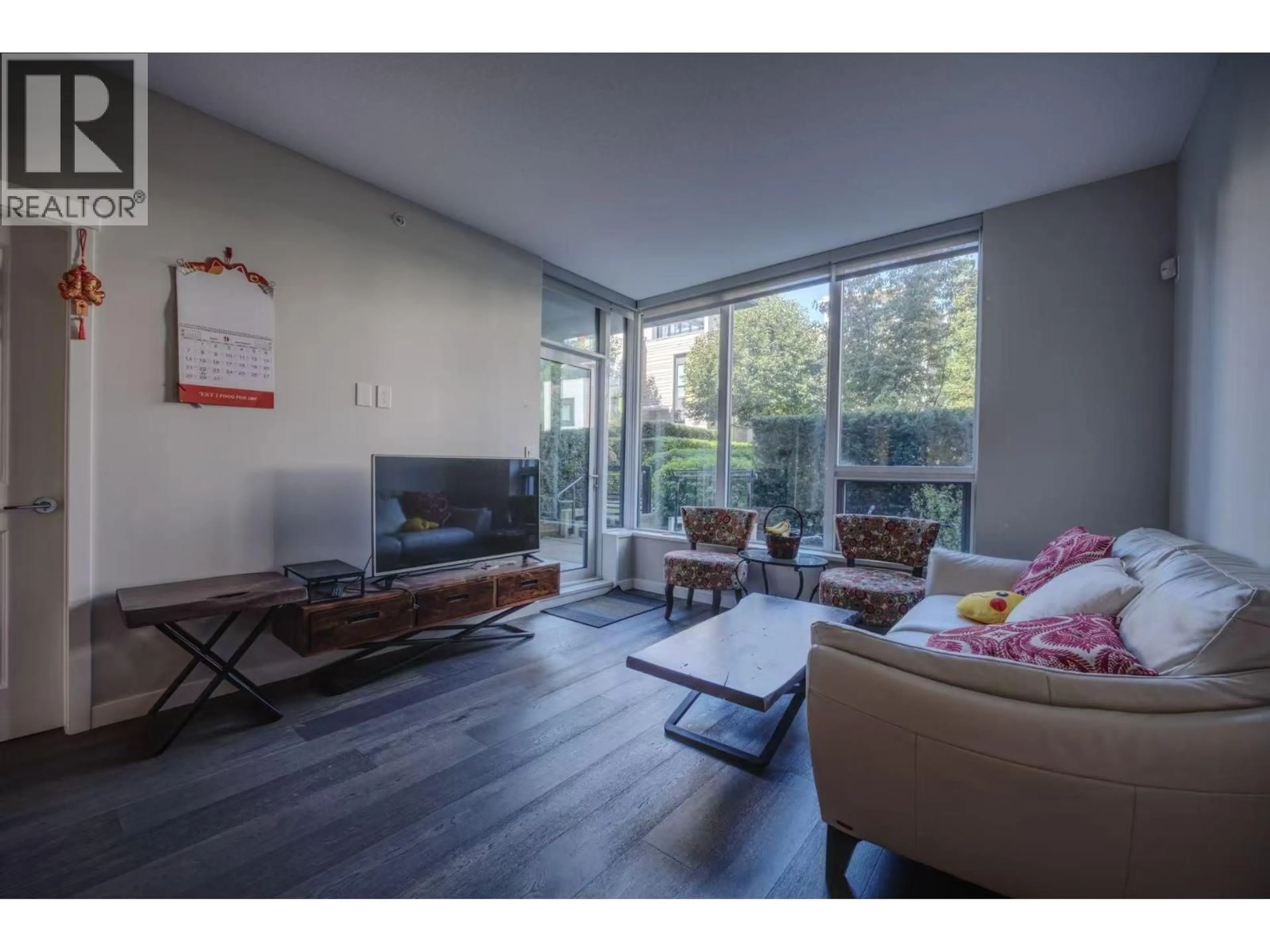 Living room with furniture, wood/laminate floor for 115 - 5687 GRAY AVENUE, Vancouver British Columbia V6S0K7