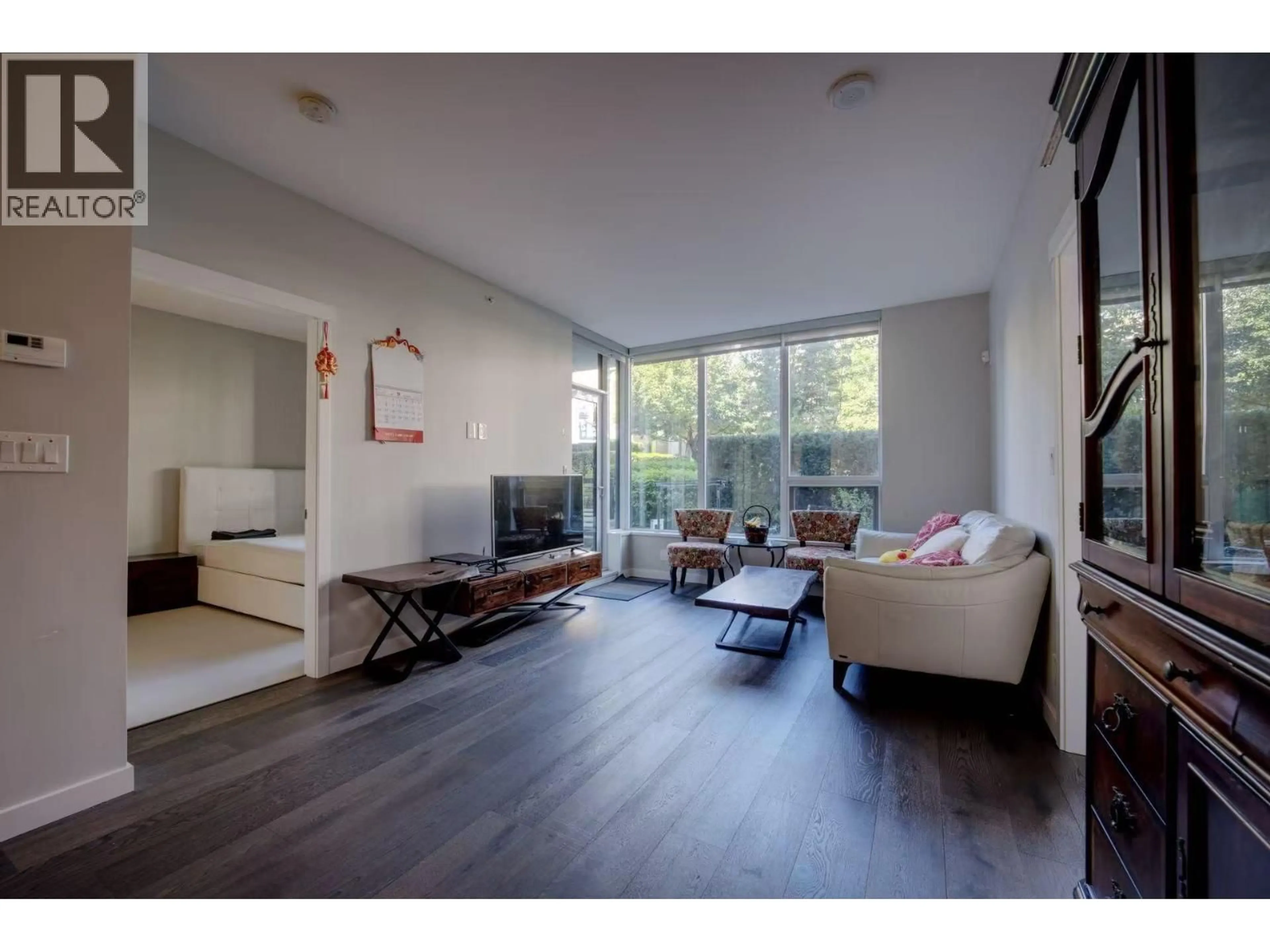 Living room with furniture, wood/laminate floor for 115 - 5687 GRAY AVENUE, Vancouver British Columbia V6S0K7