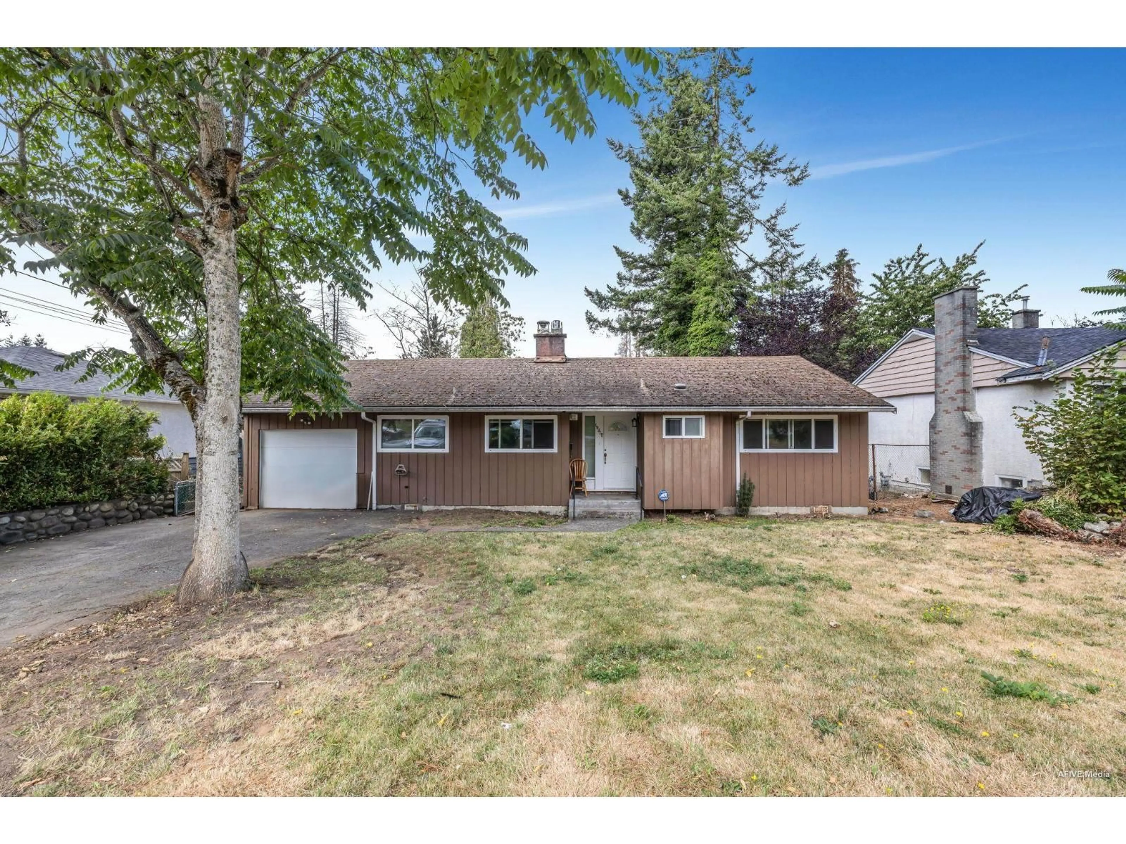 Home with vinyl exterior material, street for 10317 127, Surrey British Columbia V3V5K1